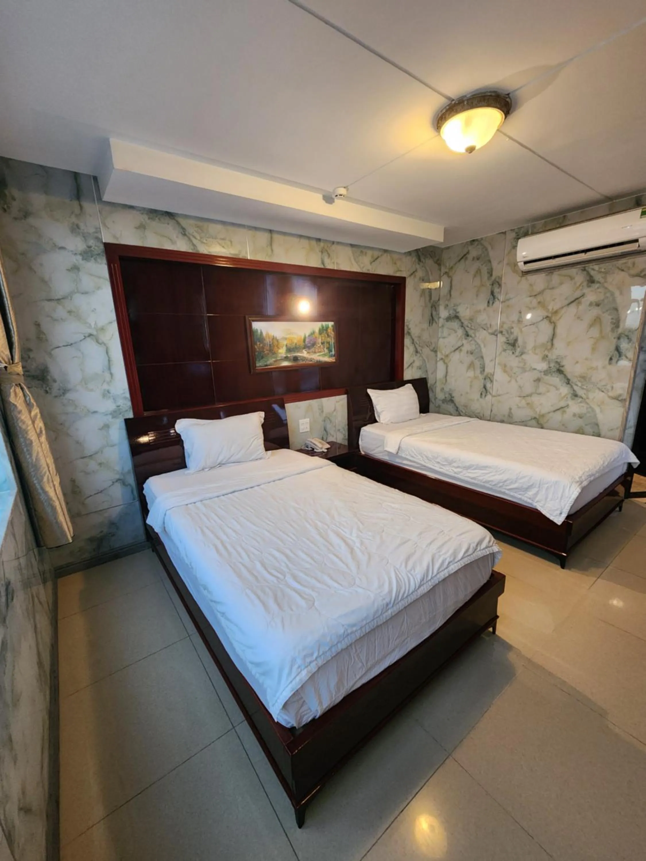 Bed in Sea Light Hotel