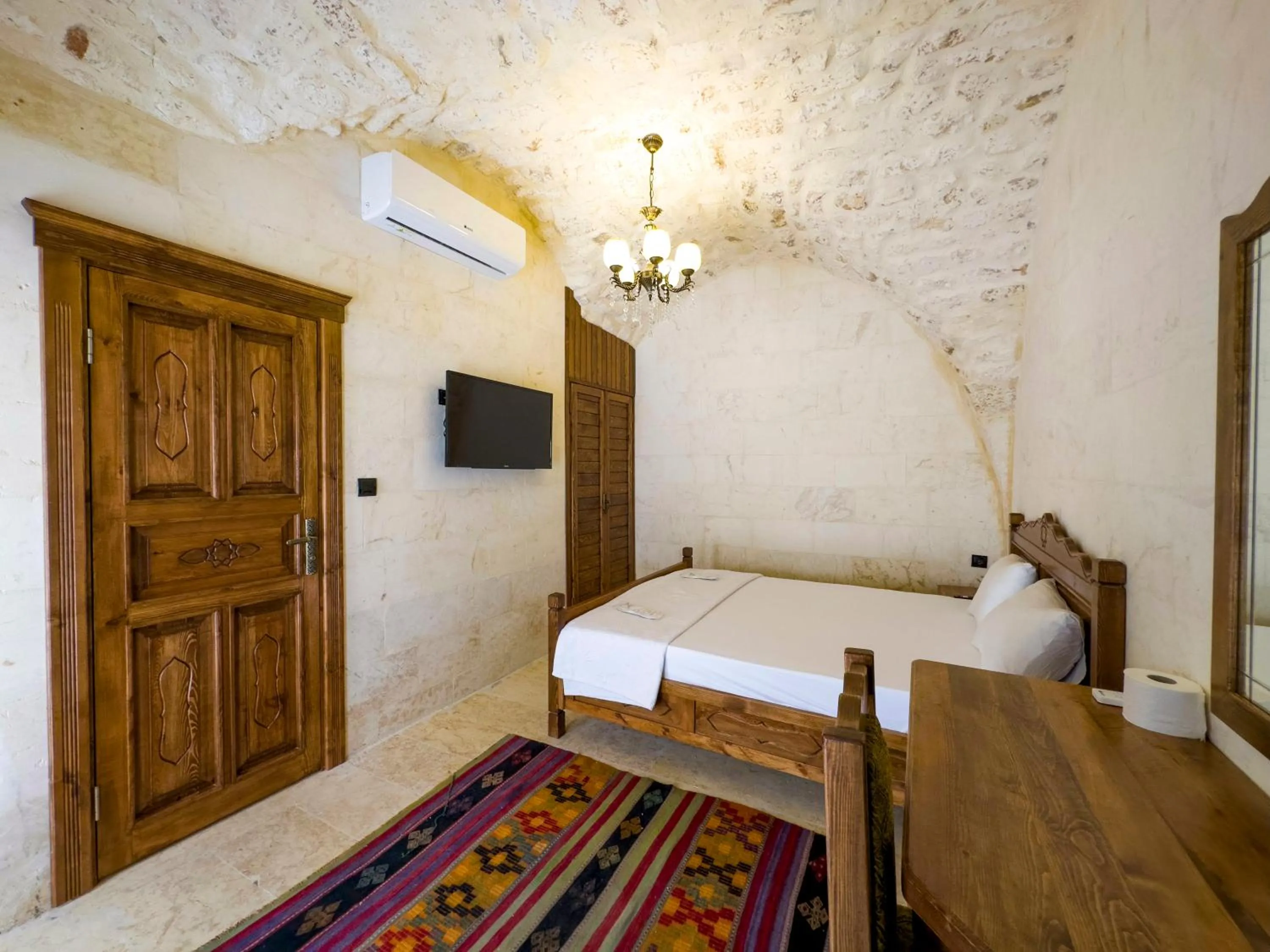 Bed in PALMYRA BOUTIQUE HOTEL