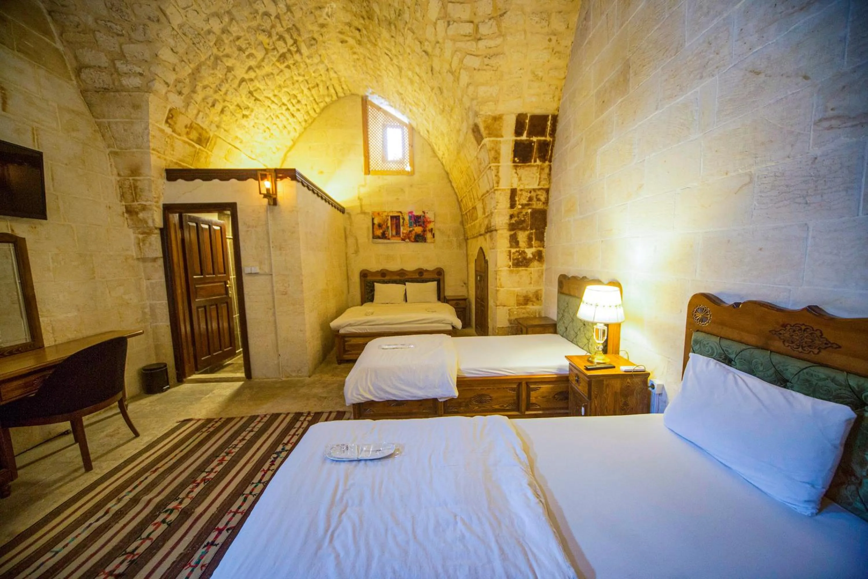 Bed in PALMYRA BOUTIQUE HOTEL