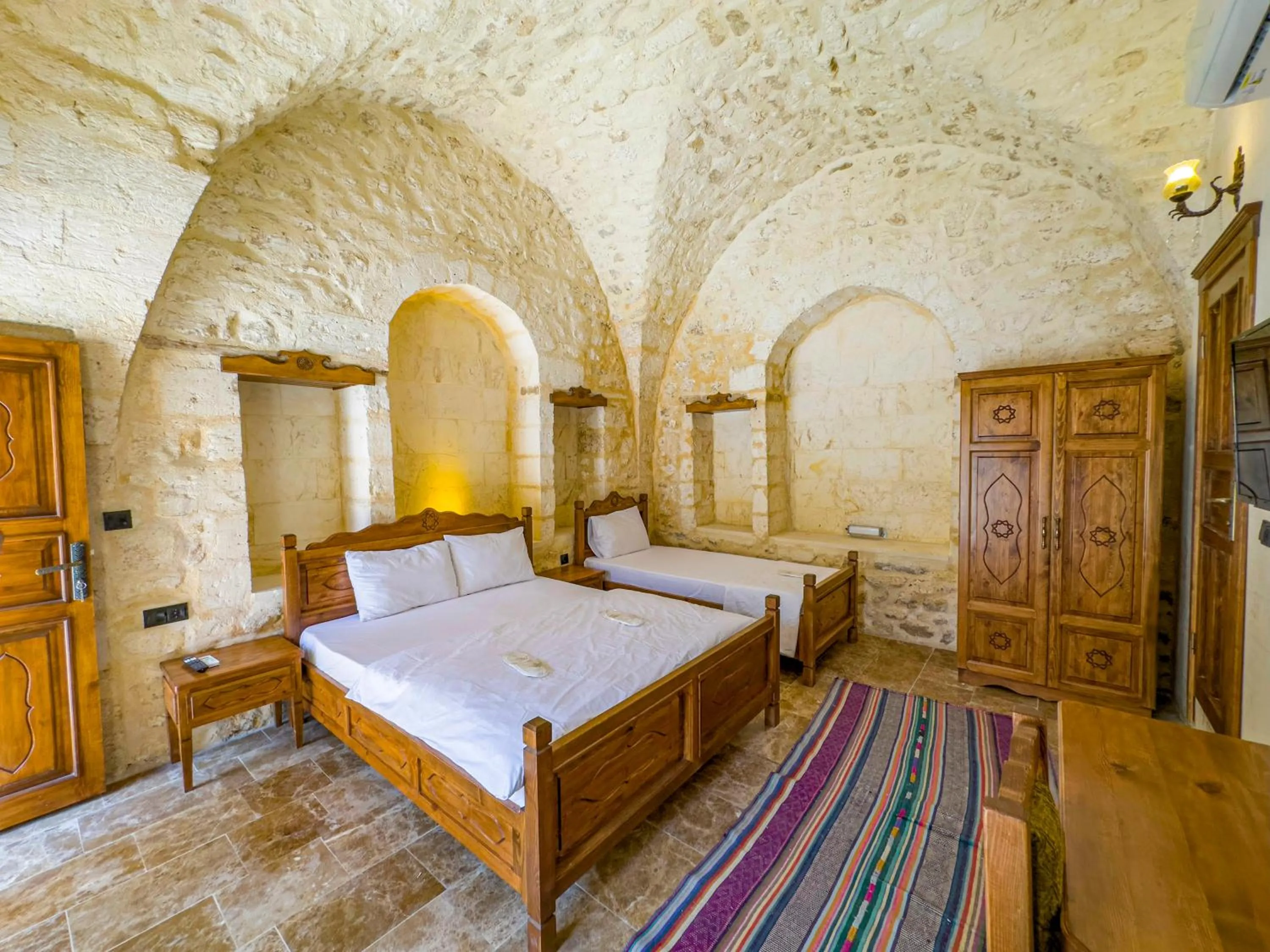 Bed in PALMYRA BOUTIQUE HOTEL