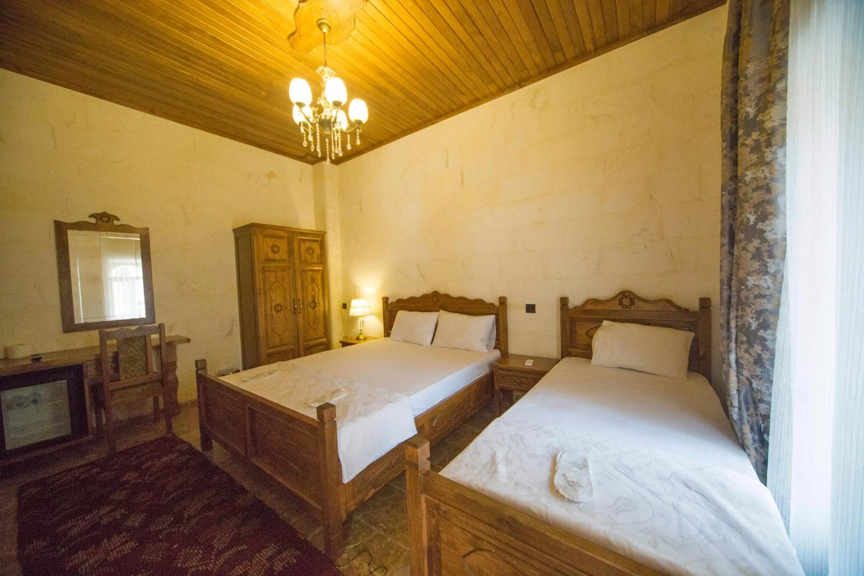 Bed in PALMYRA BOUTIQUE HOTEL