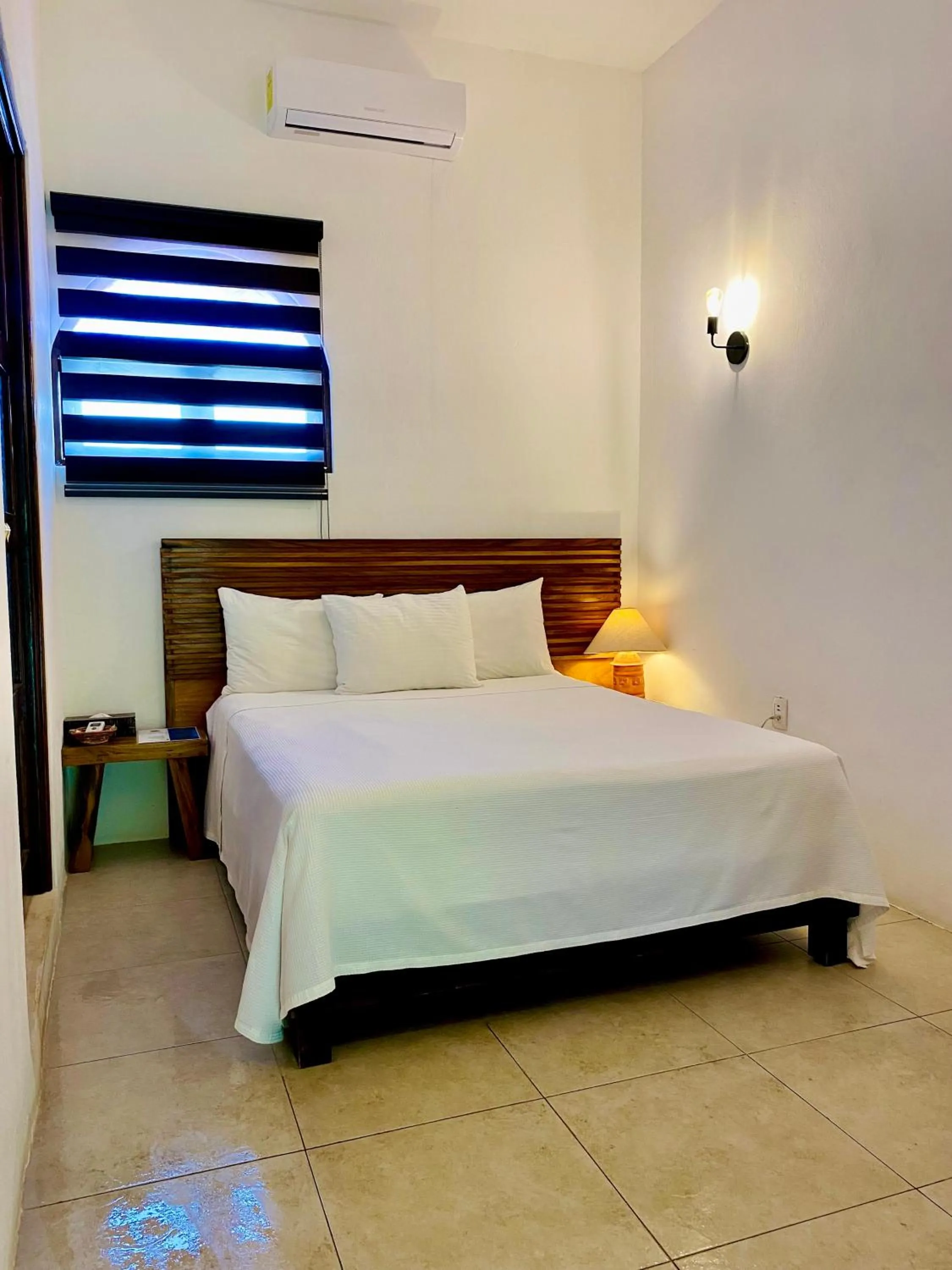 Bed in Villas El Encanto Cozumel