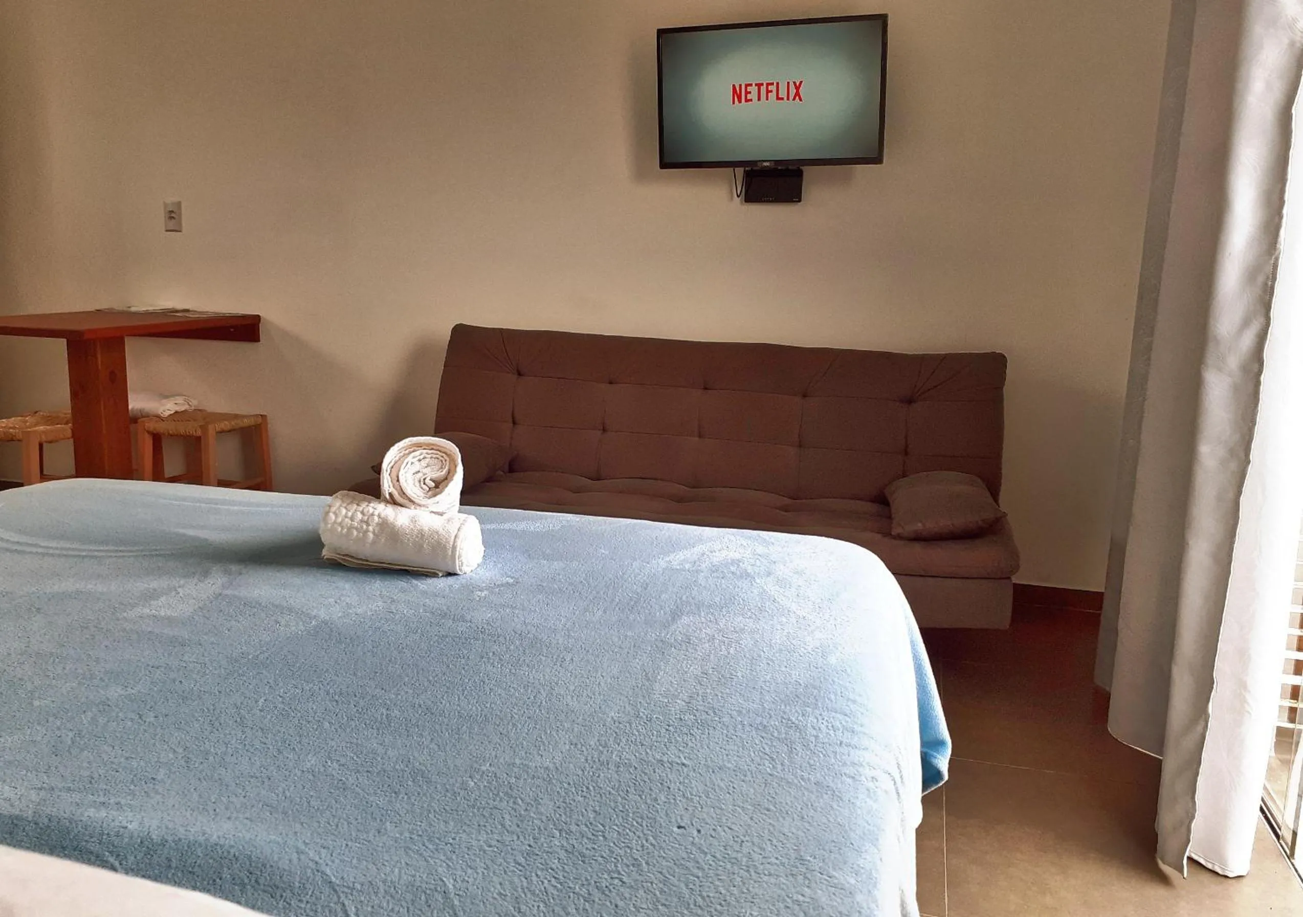 Bed in Pousada Suítes do Rosa