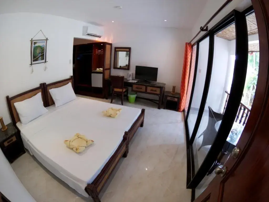 Bed in Alona Vida Beach Resort Bed in Alona Vida Beach Resort