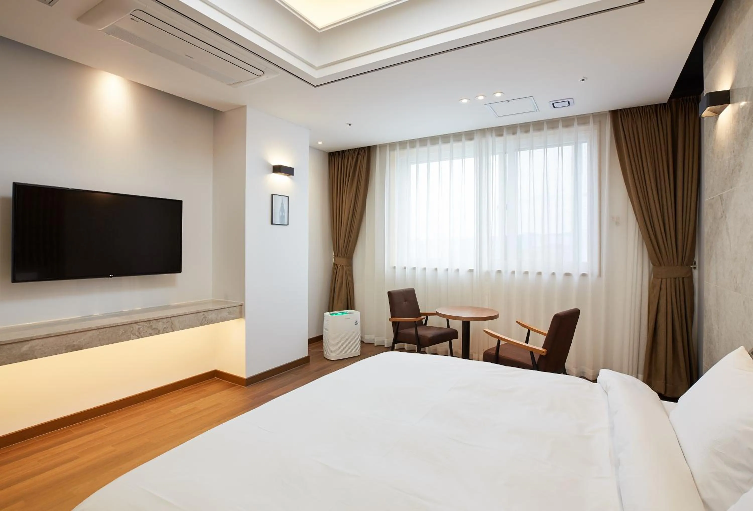 Bed in Noble Stay Hotel