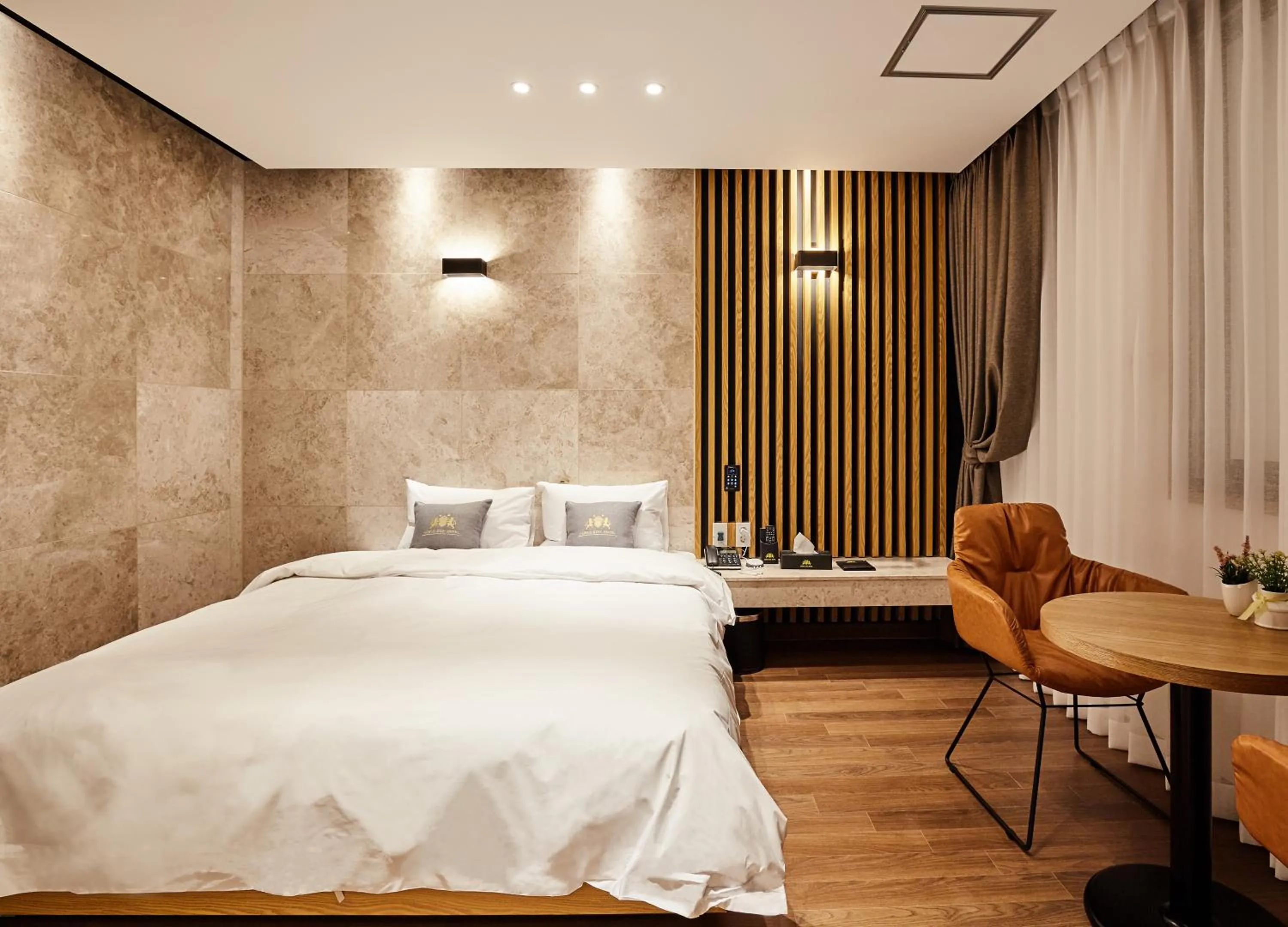 Bed in Noble Stay Hotel