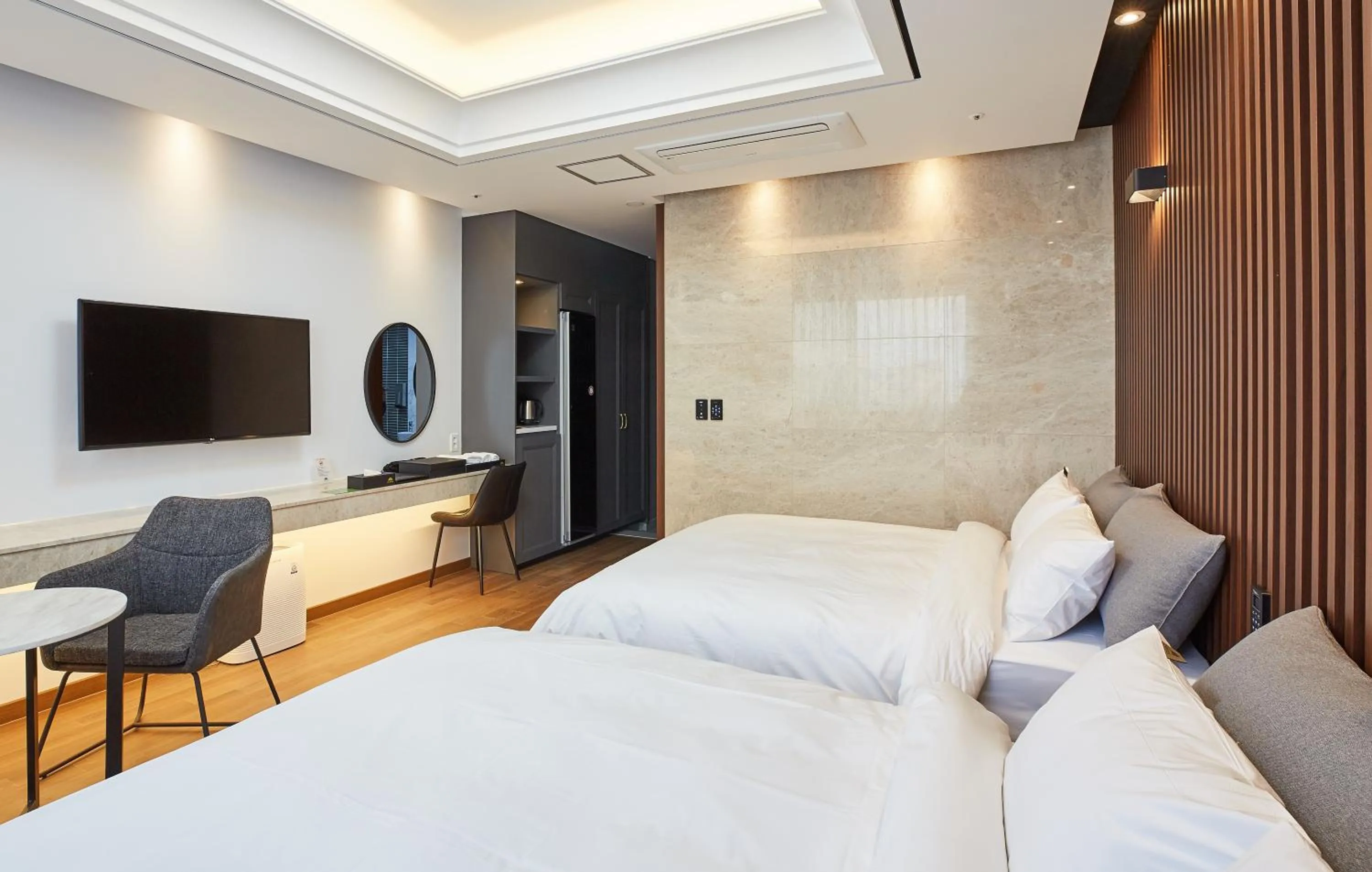 Bed in Noble Stay Hotel