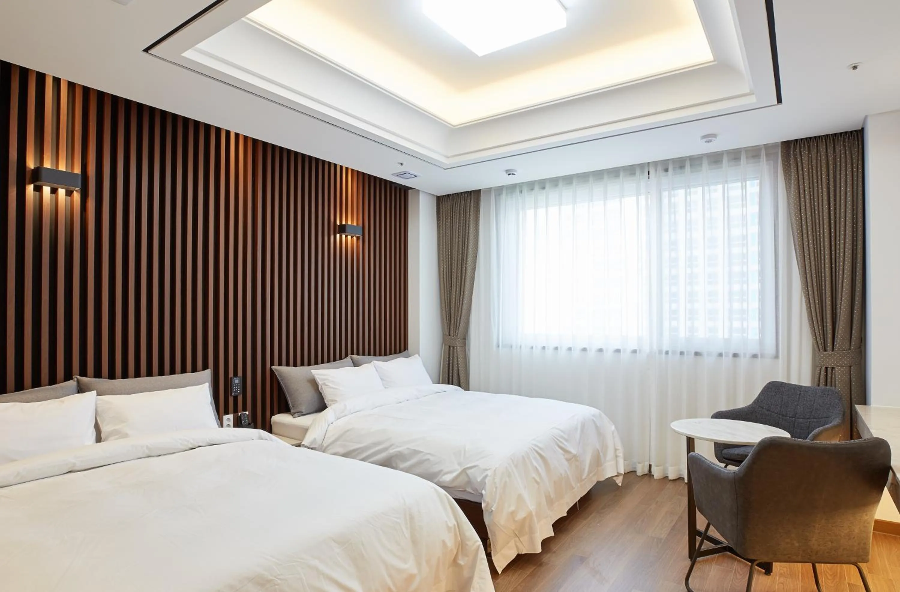 Bed in Noble Stay Hotel