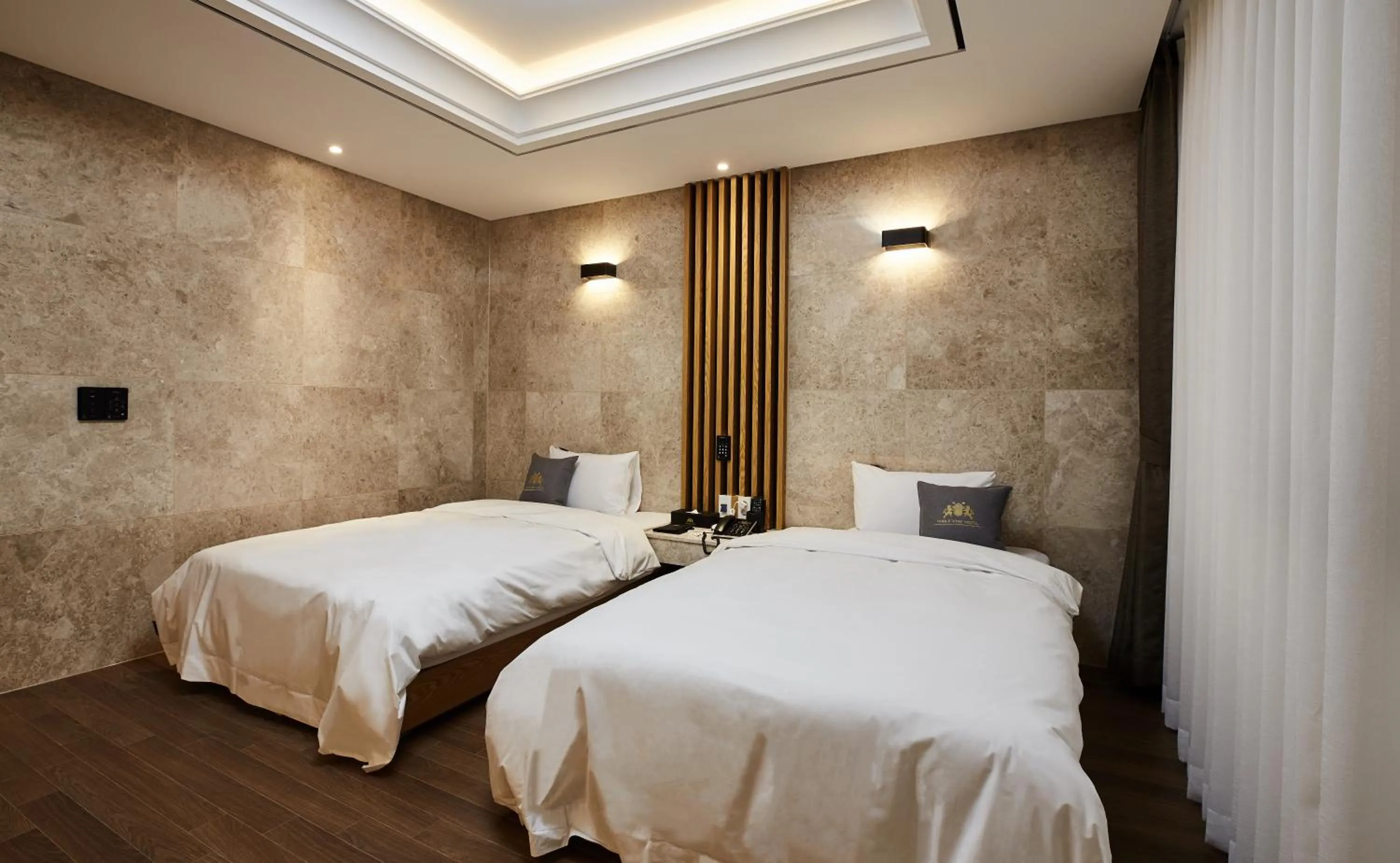 Bed in Noble Stay Hotel