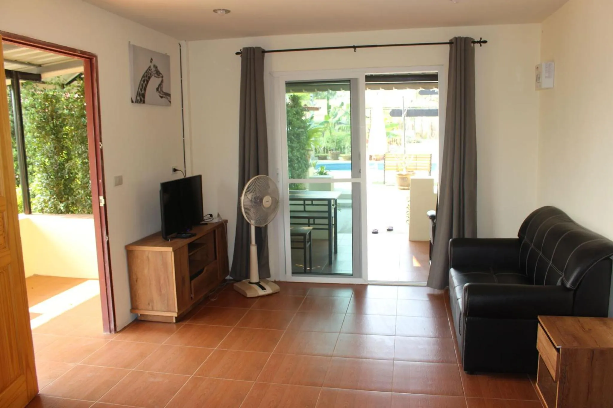 Communal lounge/ TV room in 1 bedroom pool Villa Tropical fruit garden Fast Wifi Smart Tv