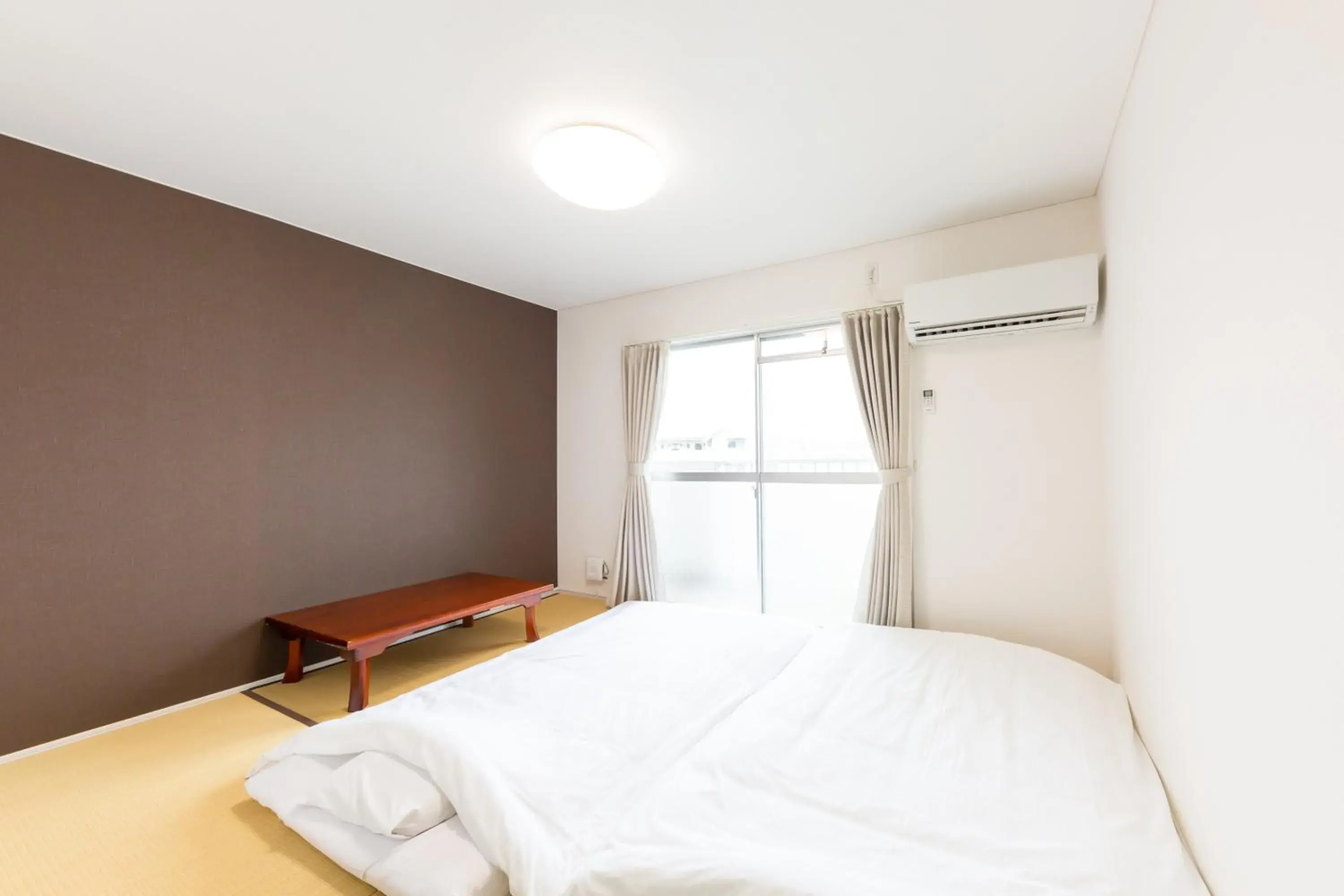 Bed in Tabist Motodai Business Hotel Kanonji Bed in Tabist Motodai Business Hotel Kanonji