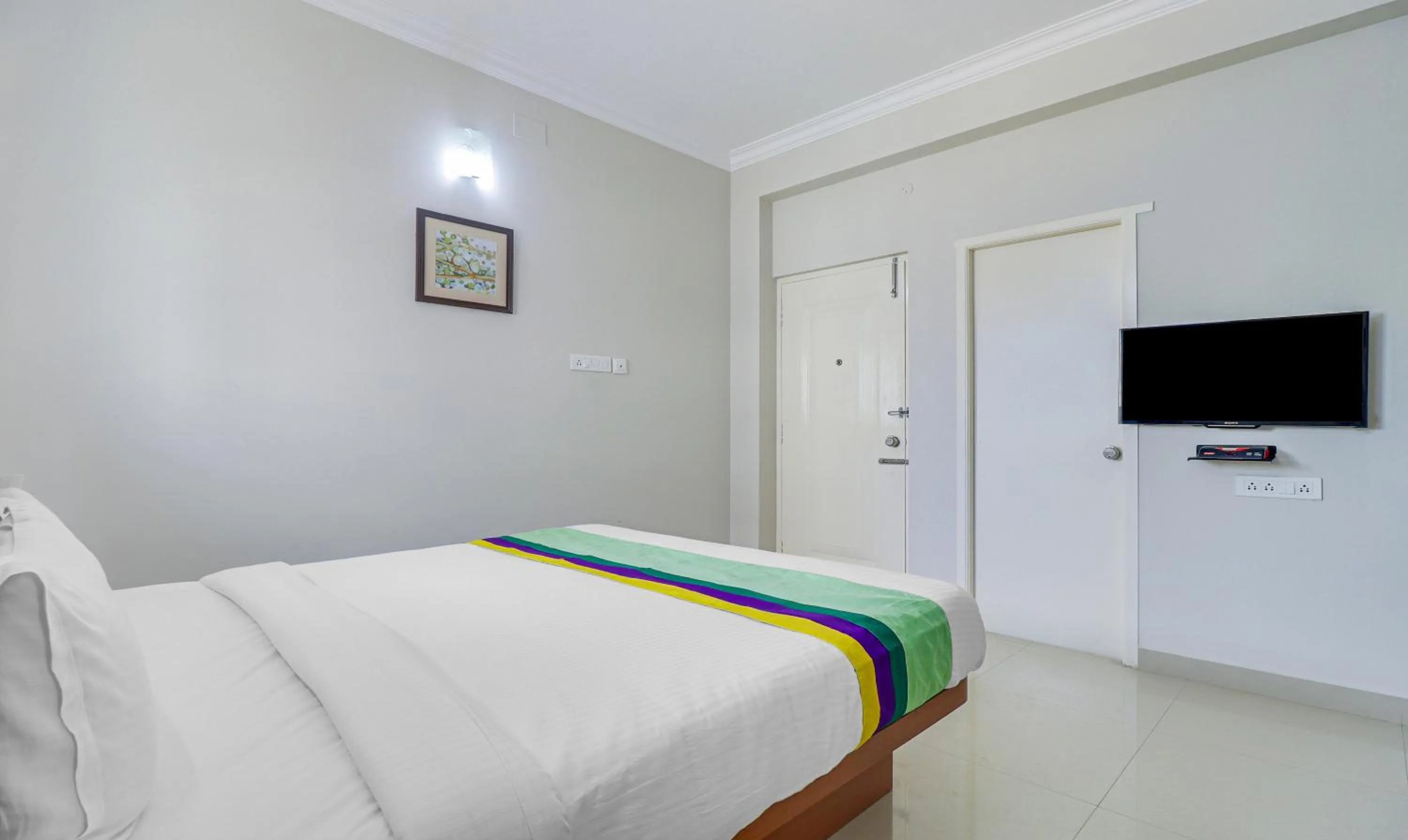 Bedroom, Bed in Treebo Rithikha Inn Elite Chennai Trade Centre