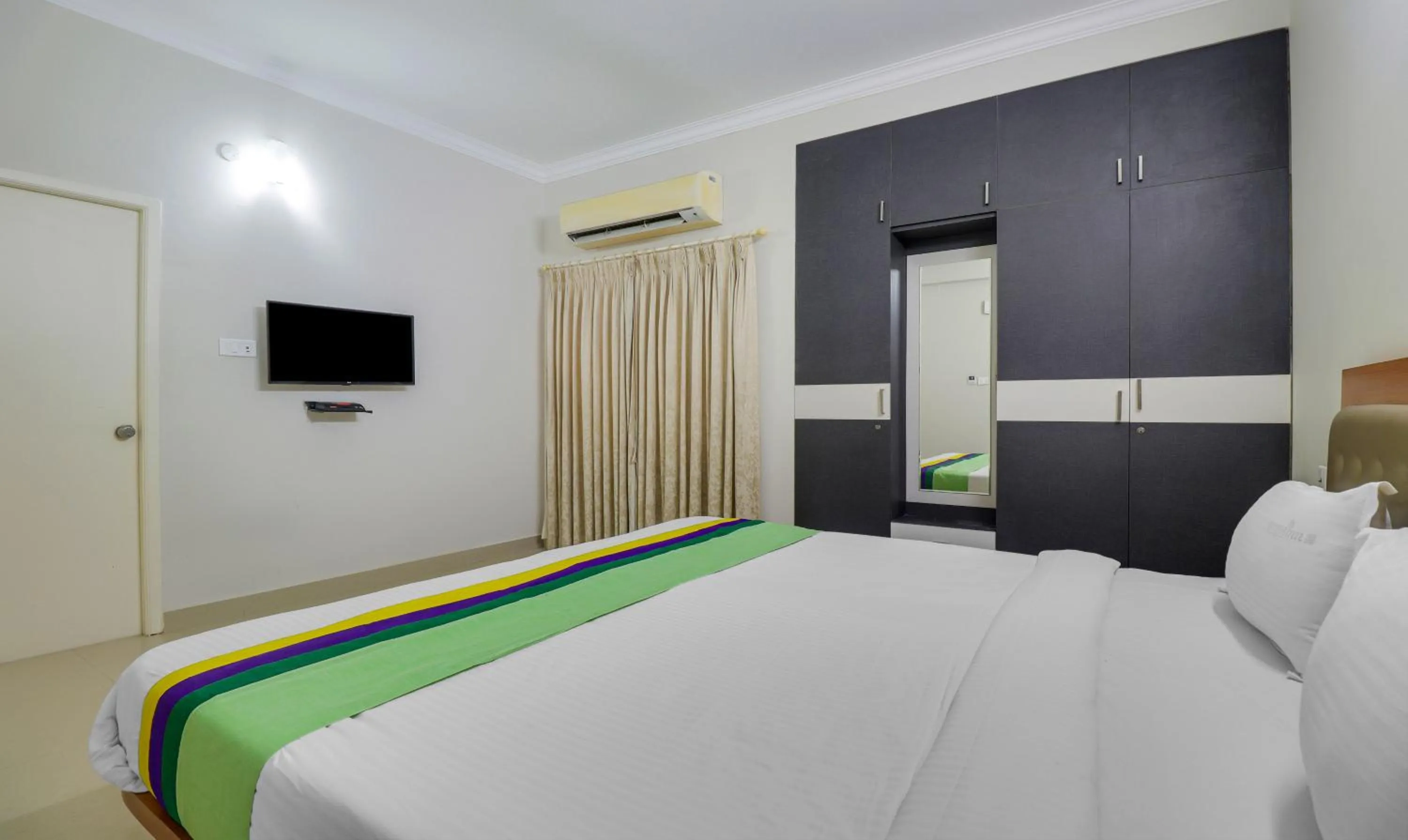 Bedroom, Bed in Treebo Rithikha Inn Elite Chennai Trade Centre