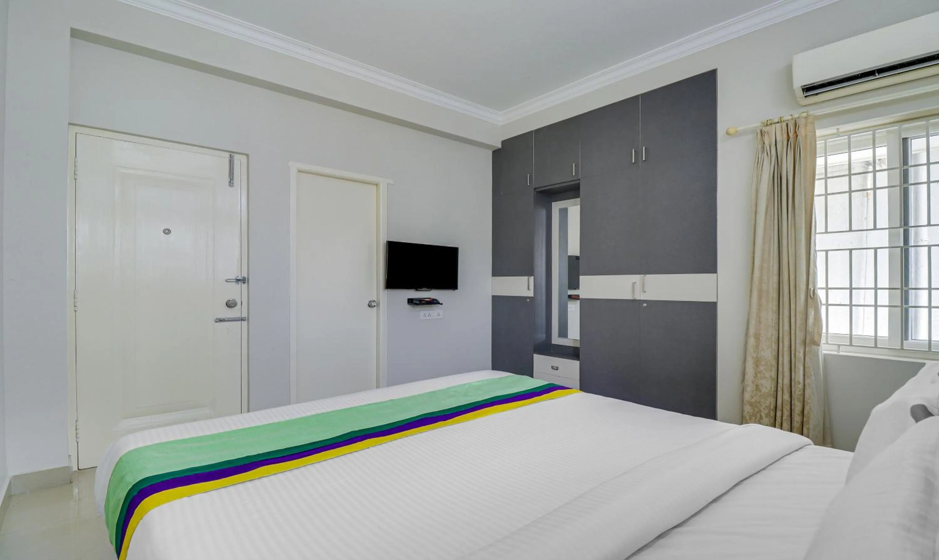 Bedroom, Bed in Treebo Rithikha Inn Elite Chennai Trade Centre