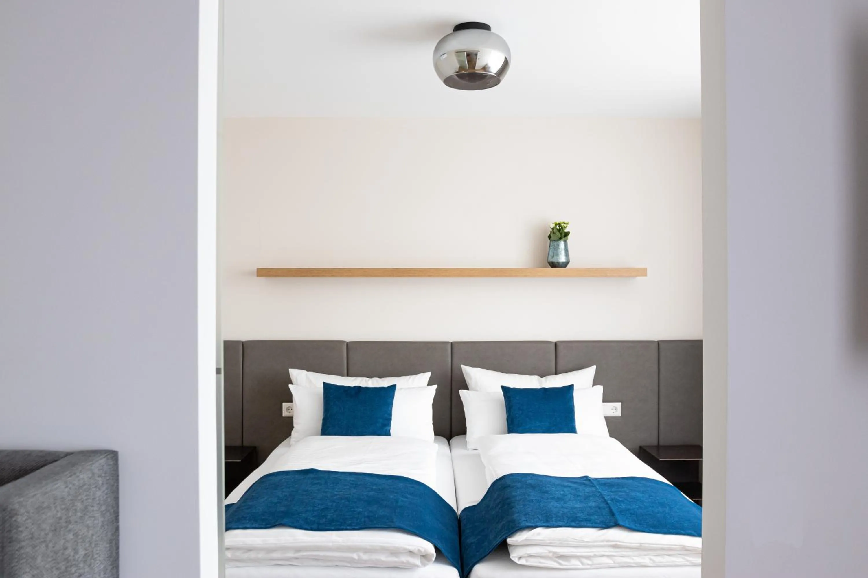 Bed in bodenseezeit Apartmenthotel Garni