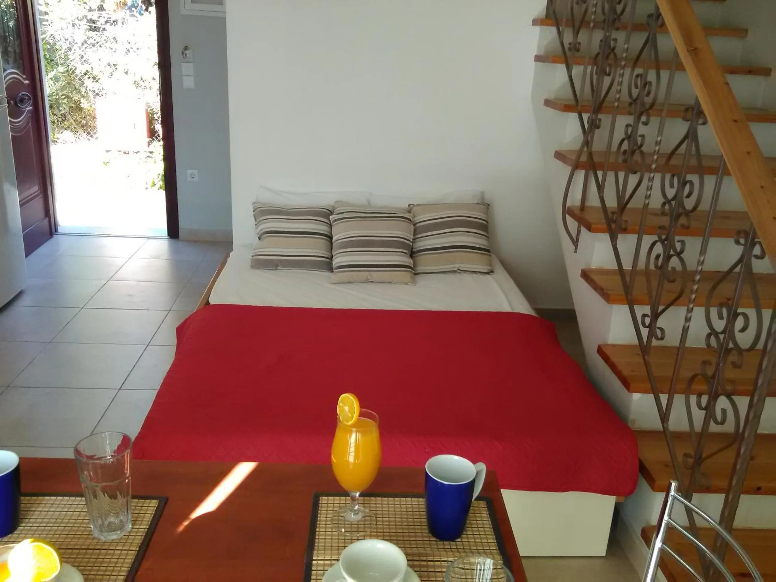 Bed in Mikros Gialos Apartments