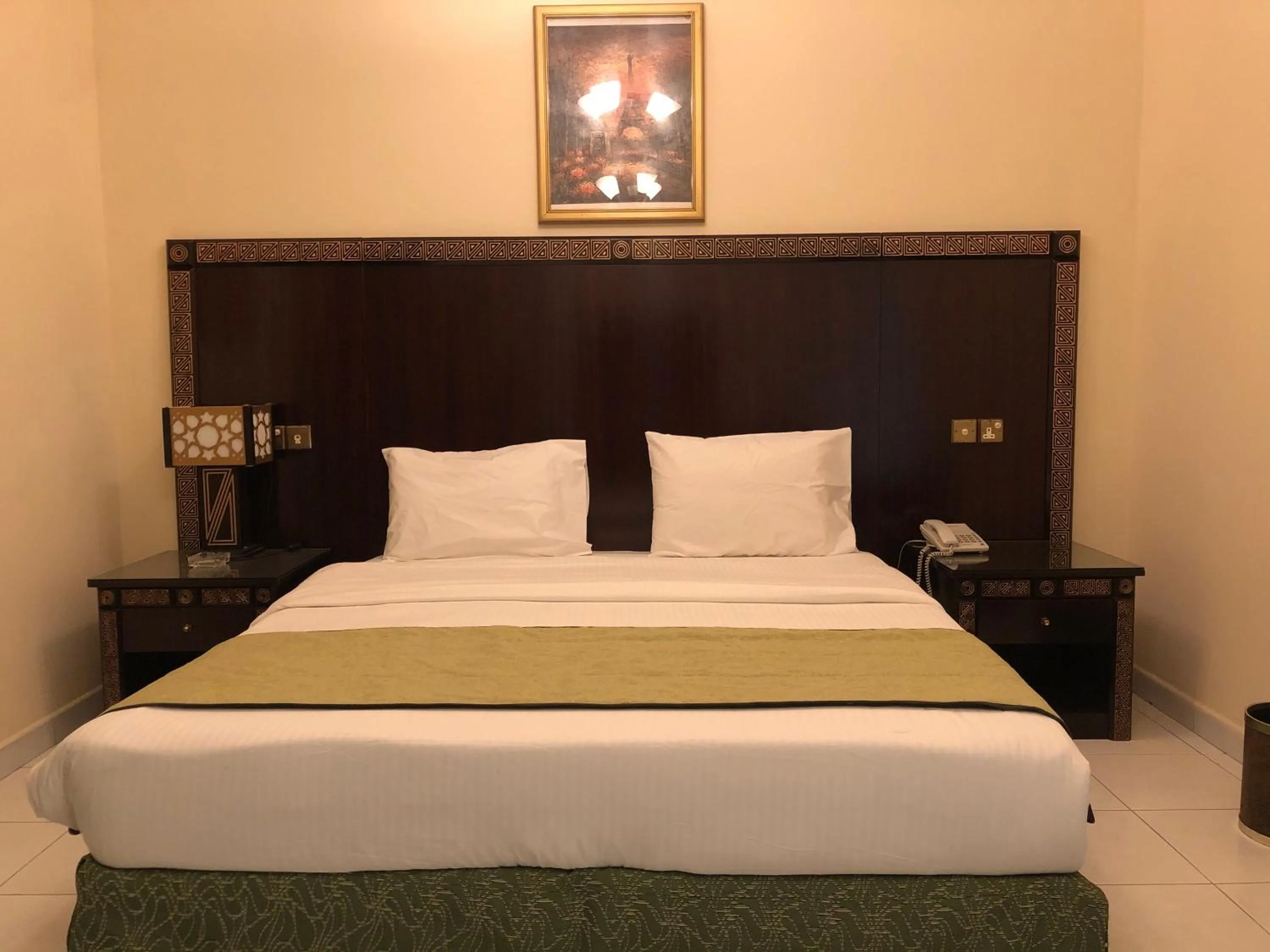 Bed in New Royal Mark Hotel Apartments