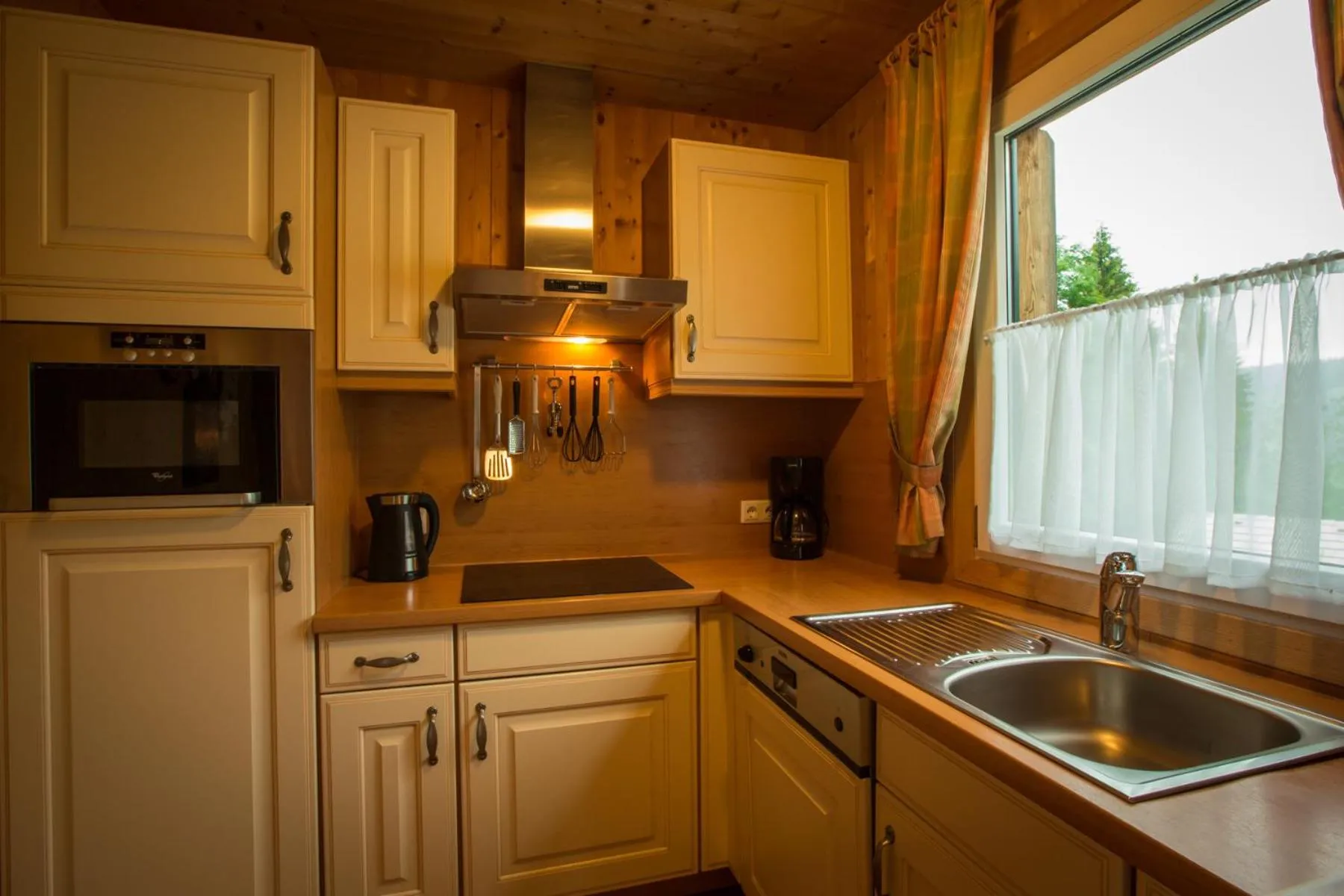Kitchen or kitchenette in Alpendorf Dachstein West by ALPS RESORTS