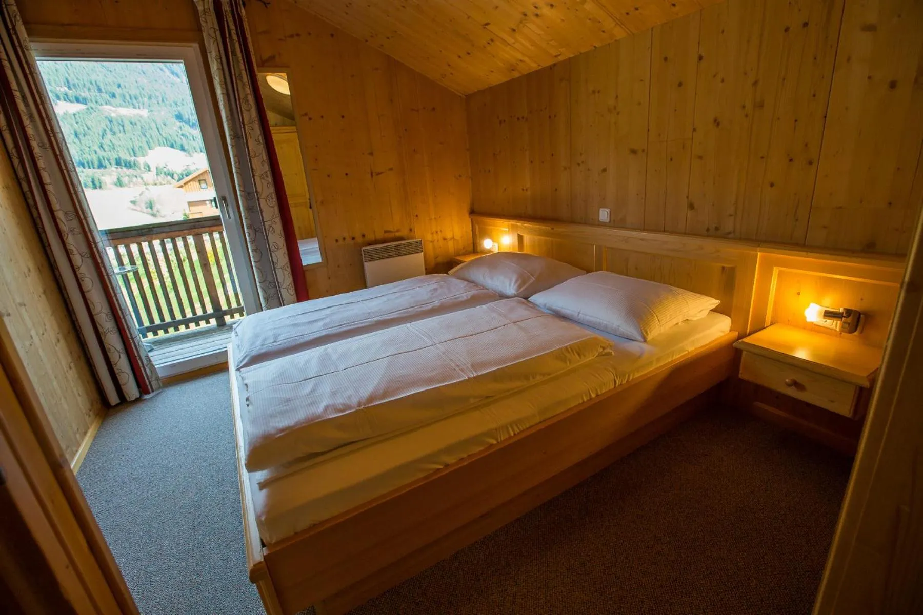 Bedroom, Bed in Alpendorf Dachstein West by ALPS RESORTS