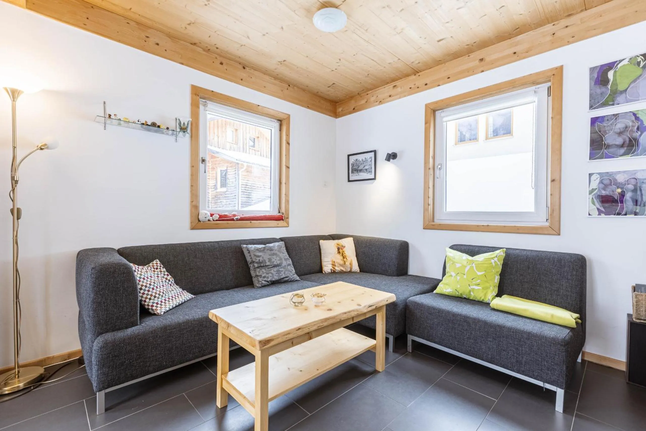 Living room in Alpendorf Dachstein West by ALPS RESORTS