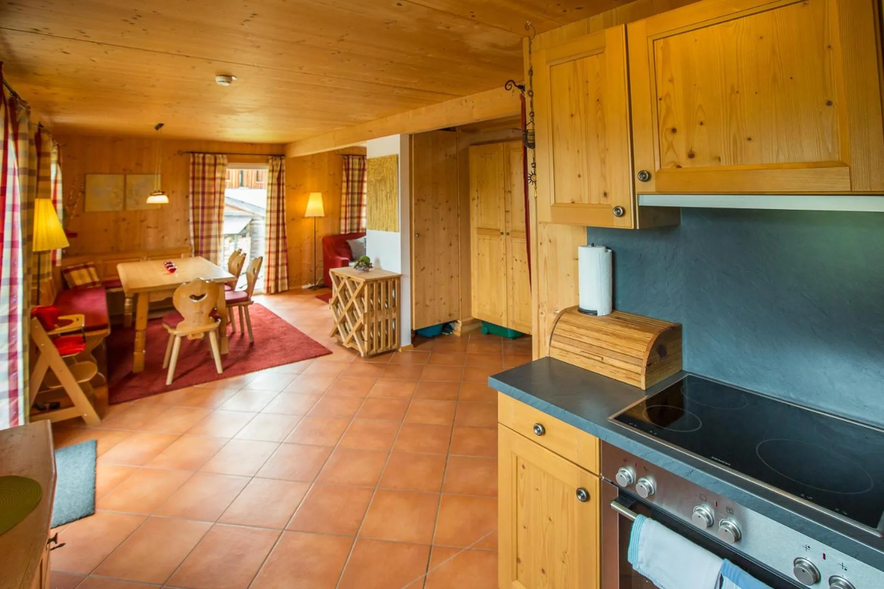 Dining area in Alpendorf Dachstein West by ALPS RESORTS