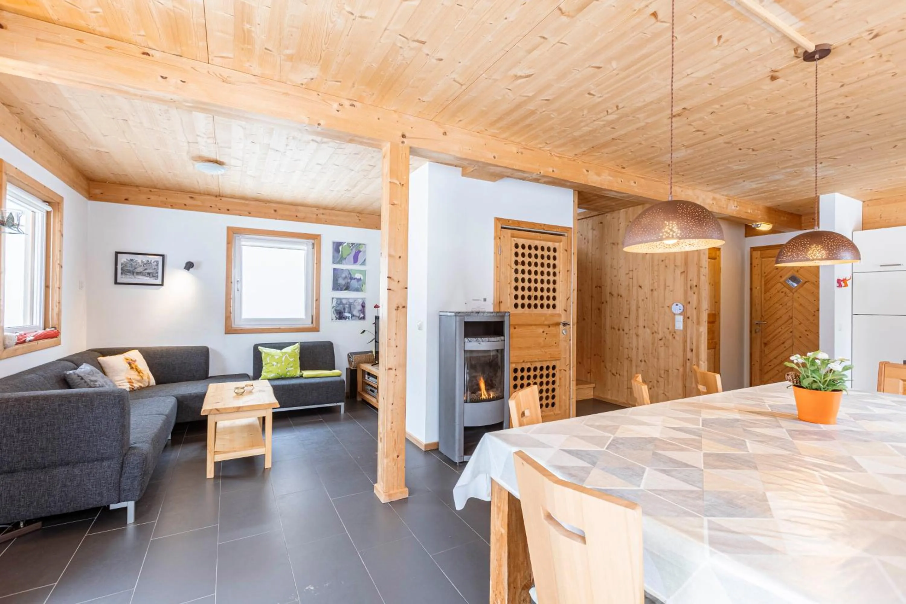 Living room in Alpendorf Dachstein West by ALPS RESORTS