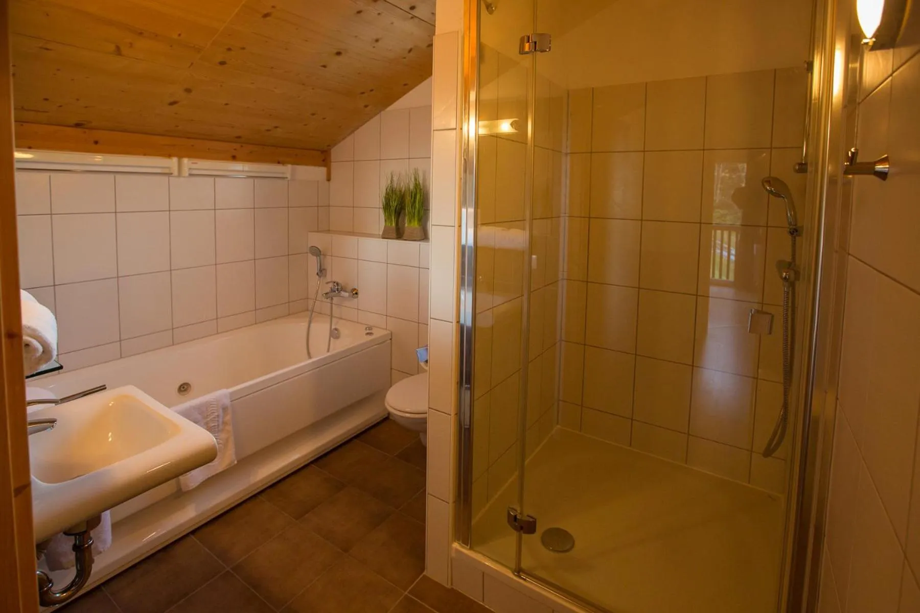 Bathroom in Alpendorf Dachstein West by ALPS RESORTS