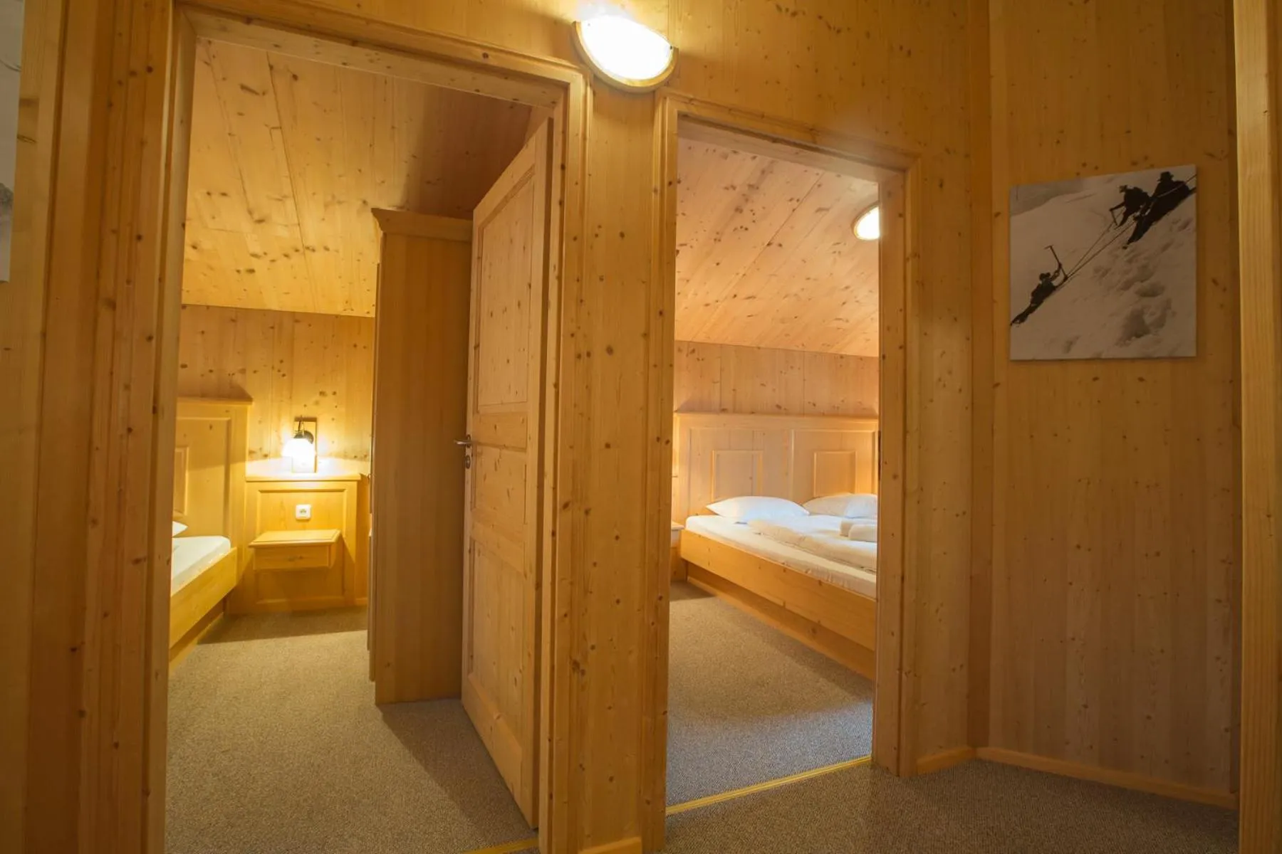 Bedroom, Bed in Alpendorf Dachstein West by ALPS RESORTS