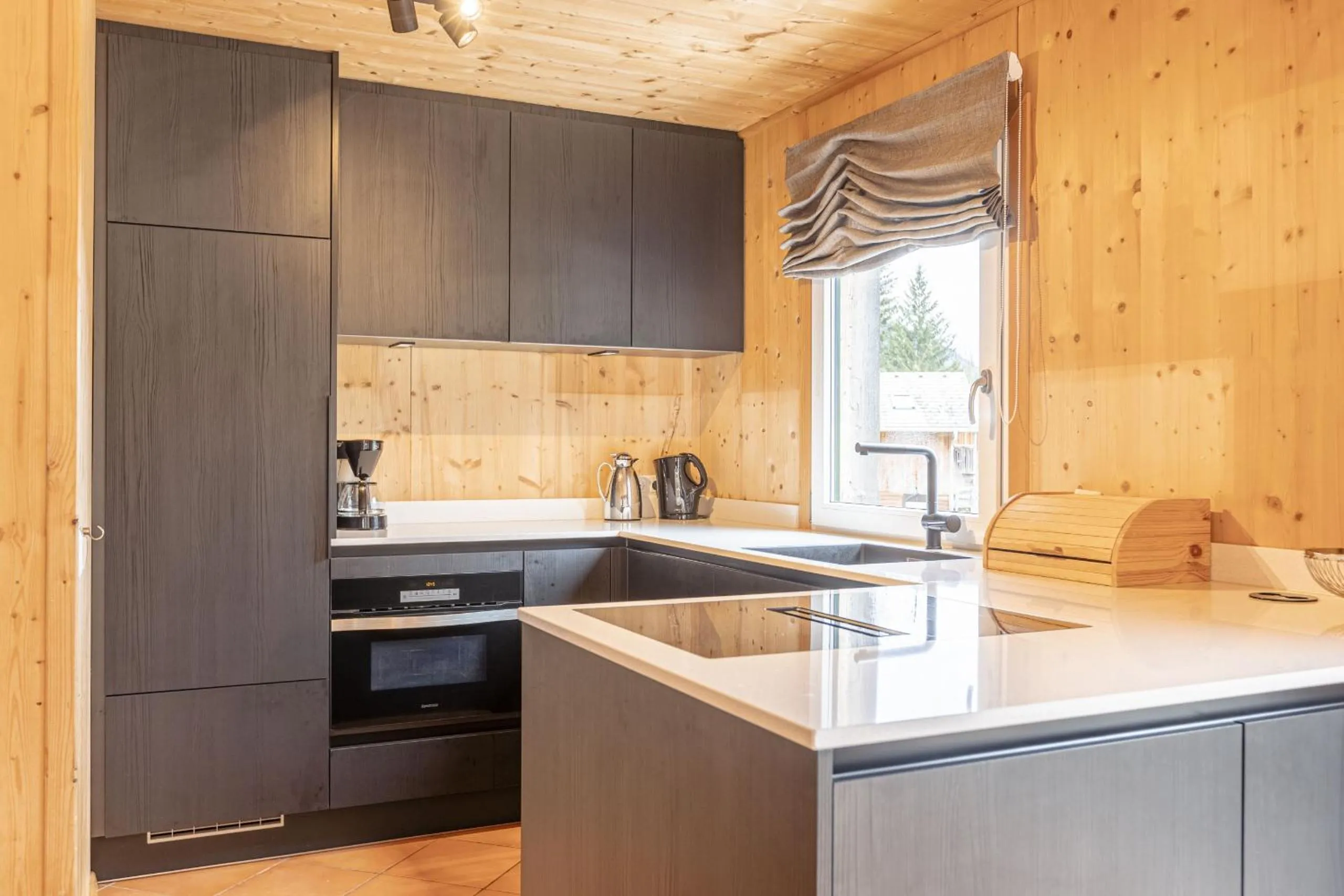 Kitchen or kitchenette in Alpendorf Dachstein West by ALPS RESORTS