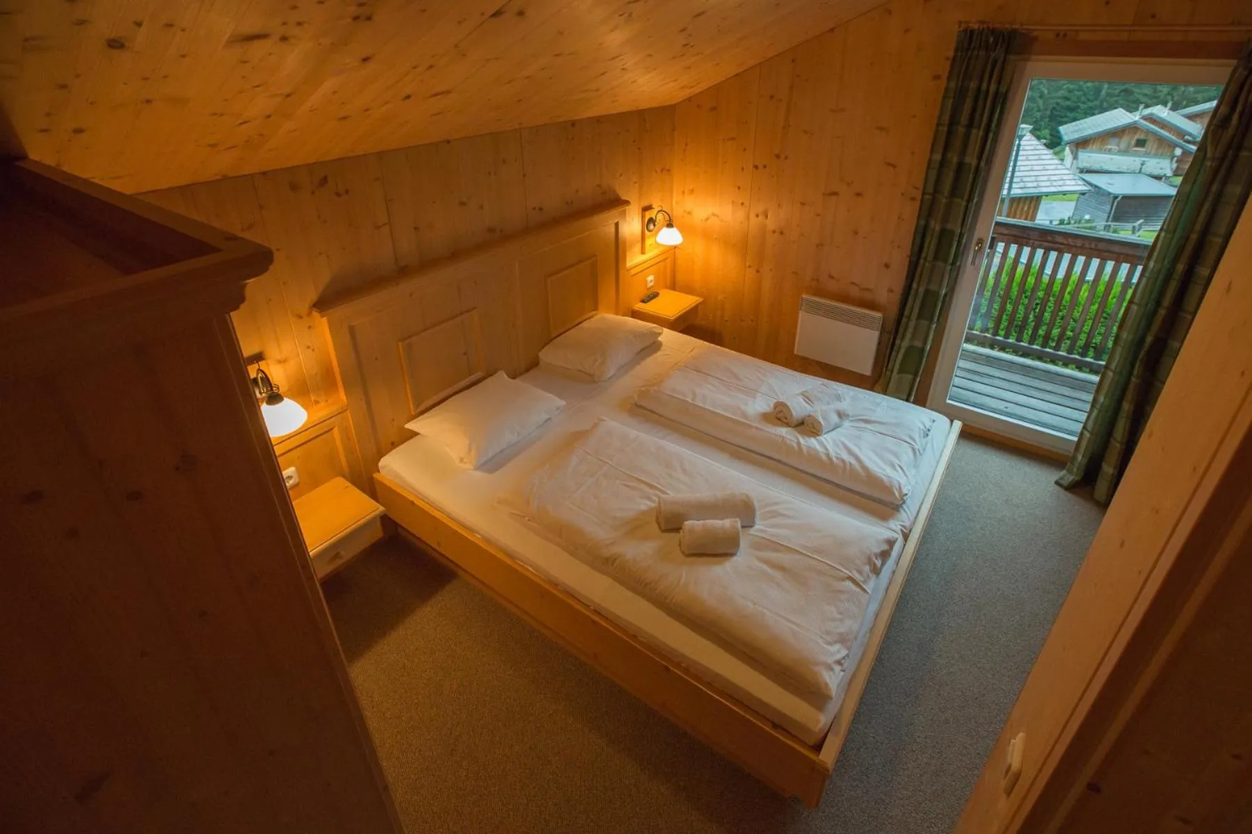 Bedroom, Bed in Alpendorf Dachstein West by ALPS RESORTS