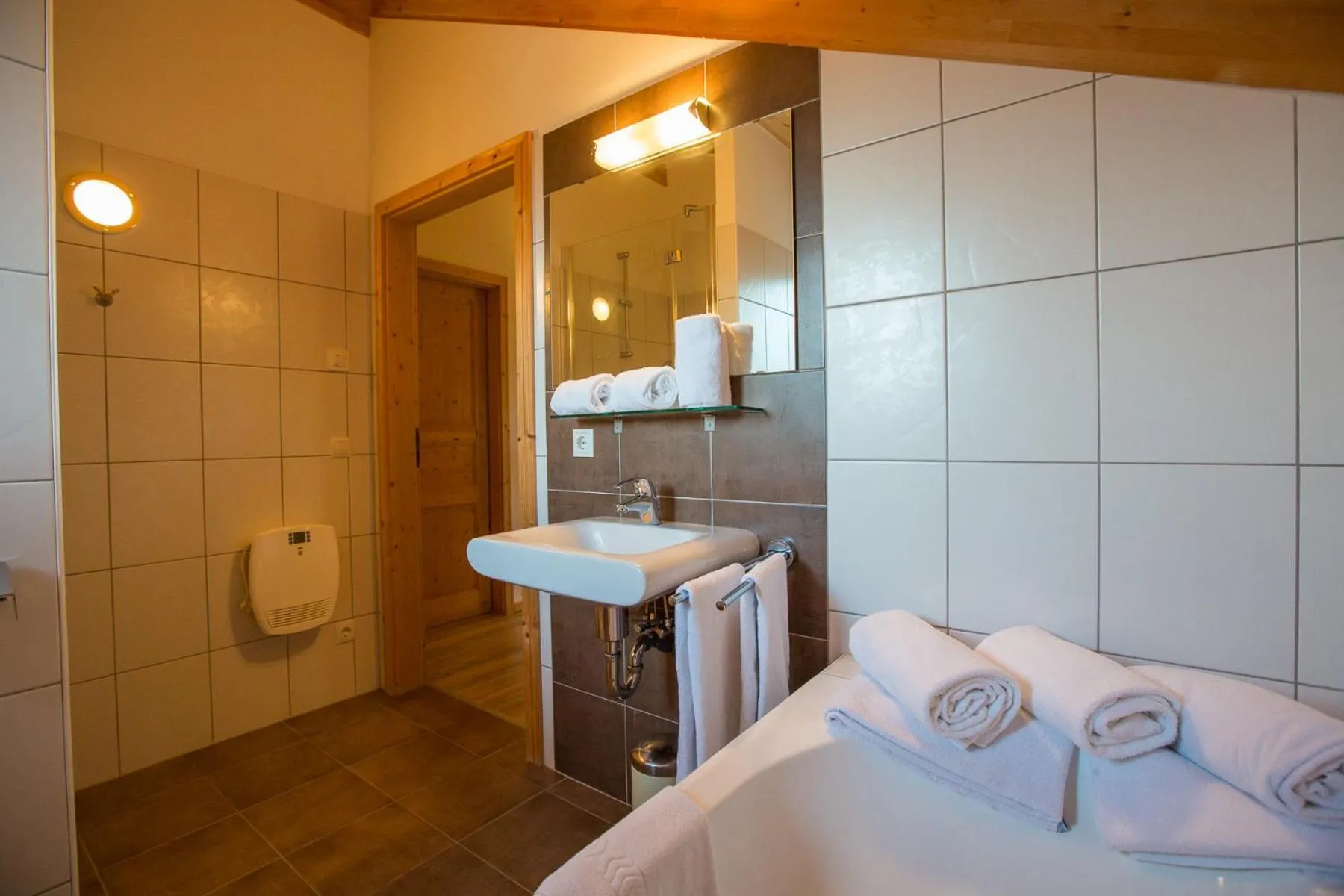 Bathroom, Bed in Alpendorf Dachstein West by ALPS RESORTS