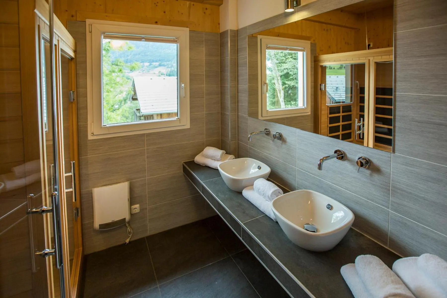 Bathroom in Alpendorf Dachstein West by ALPS RESORTS