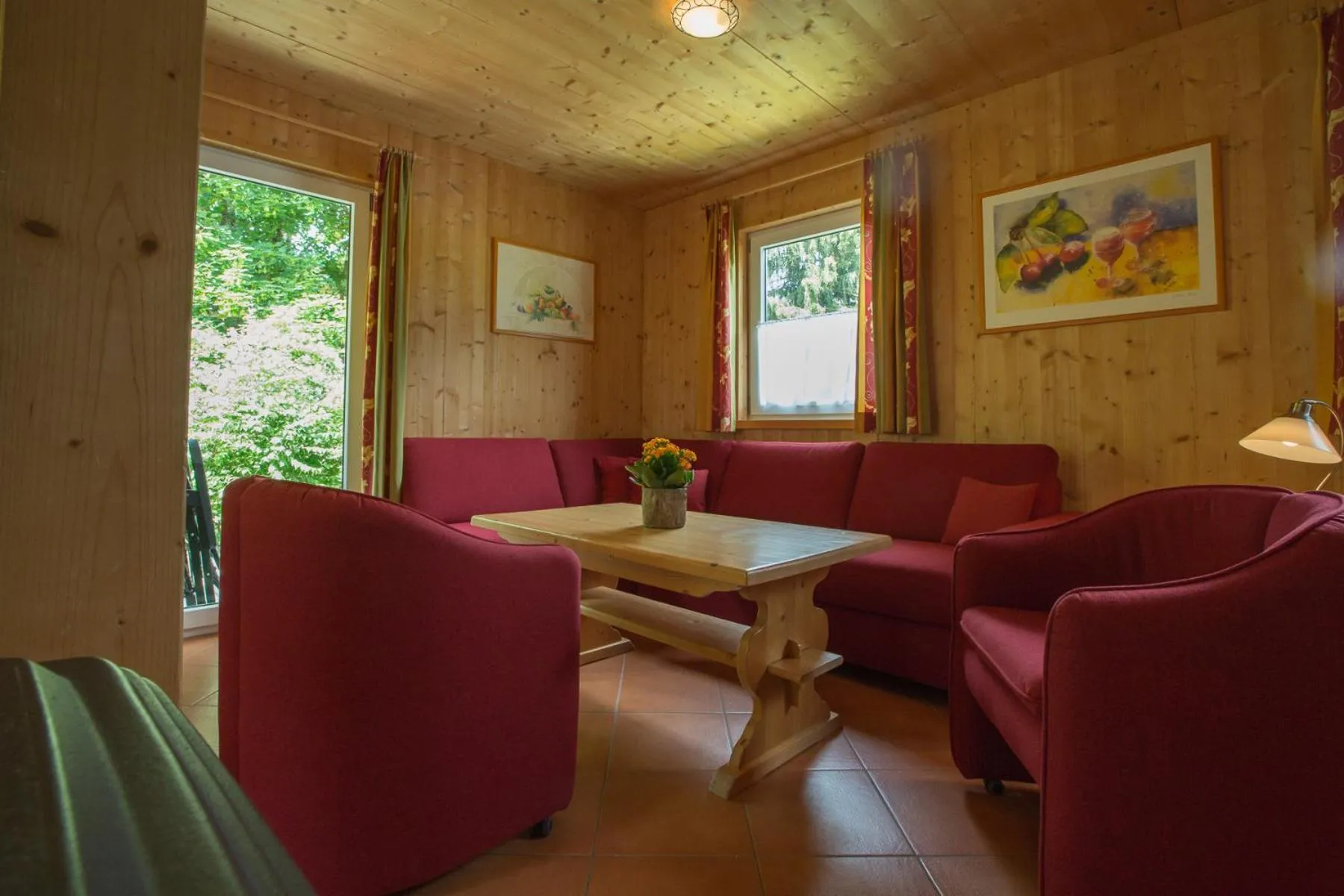 Living room in Alpendorf Dachstein West by ALPS RESORTS