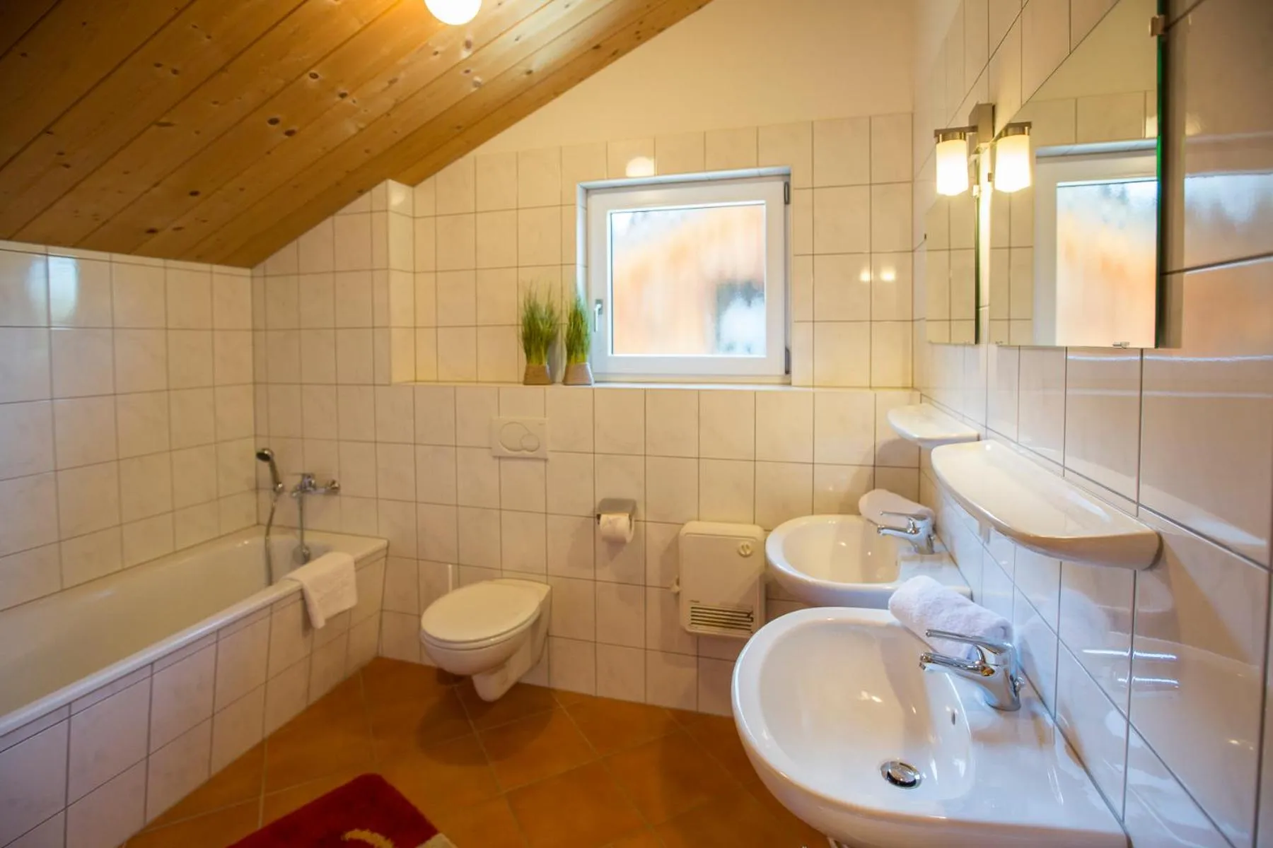 Bathroom in Alpendorf Dachstein West by ALPS RESORTS