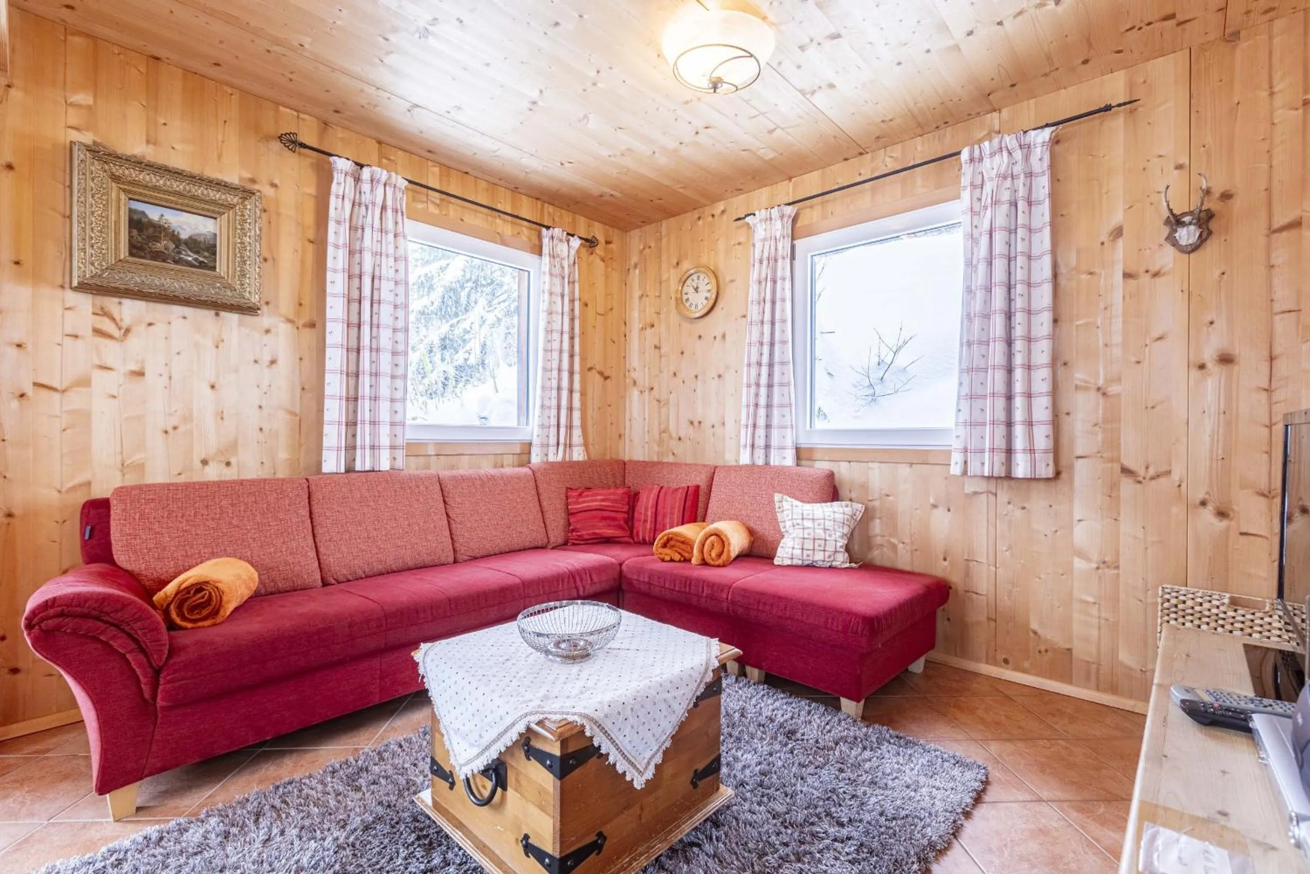Living room in Alpendorf Dachstein West by ALPS RESORTS