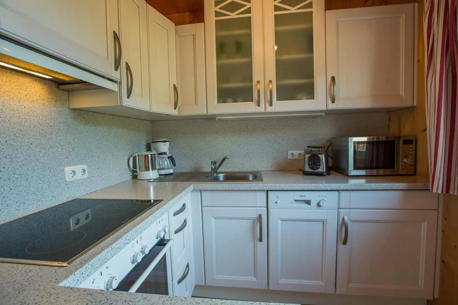 Kitchen or kitchenette in Alpendorf Dachstein West by ALPS RESORTS