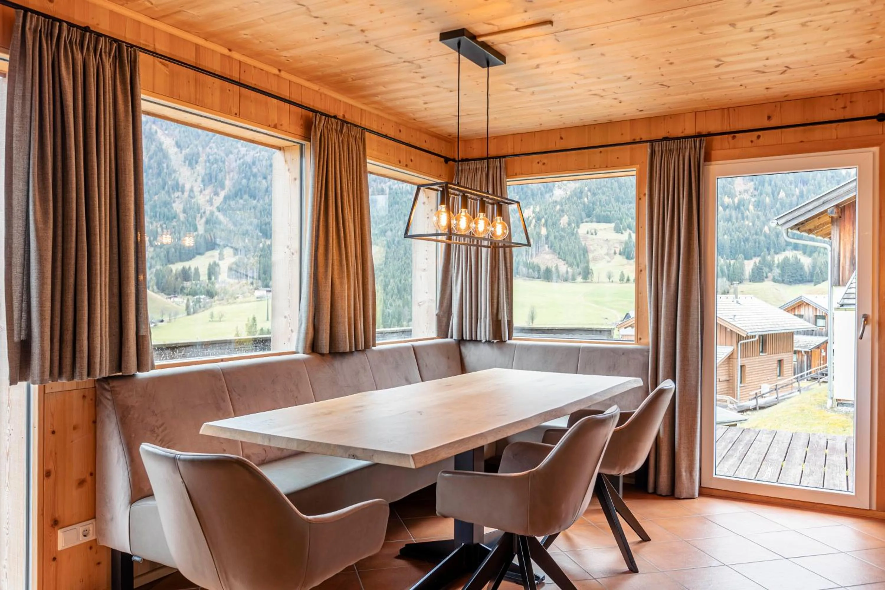 Living room in Alpendorf Dachstein West by ALPS RESORTS