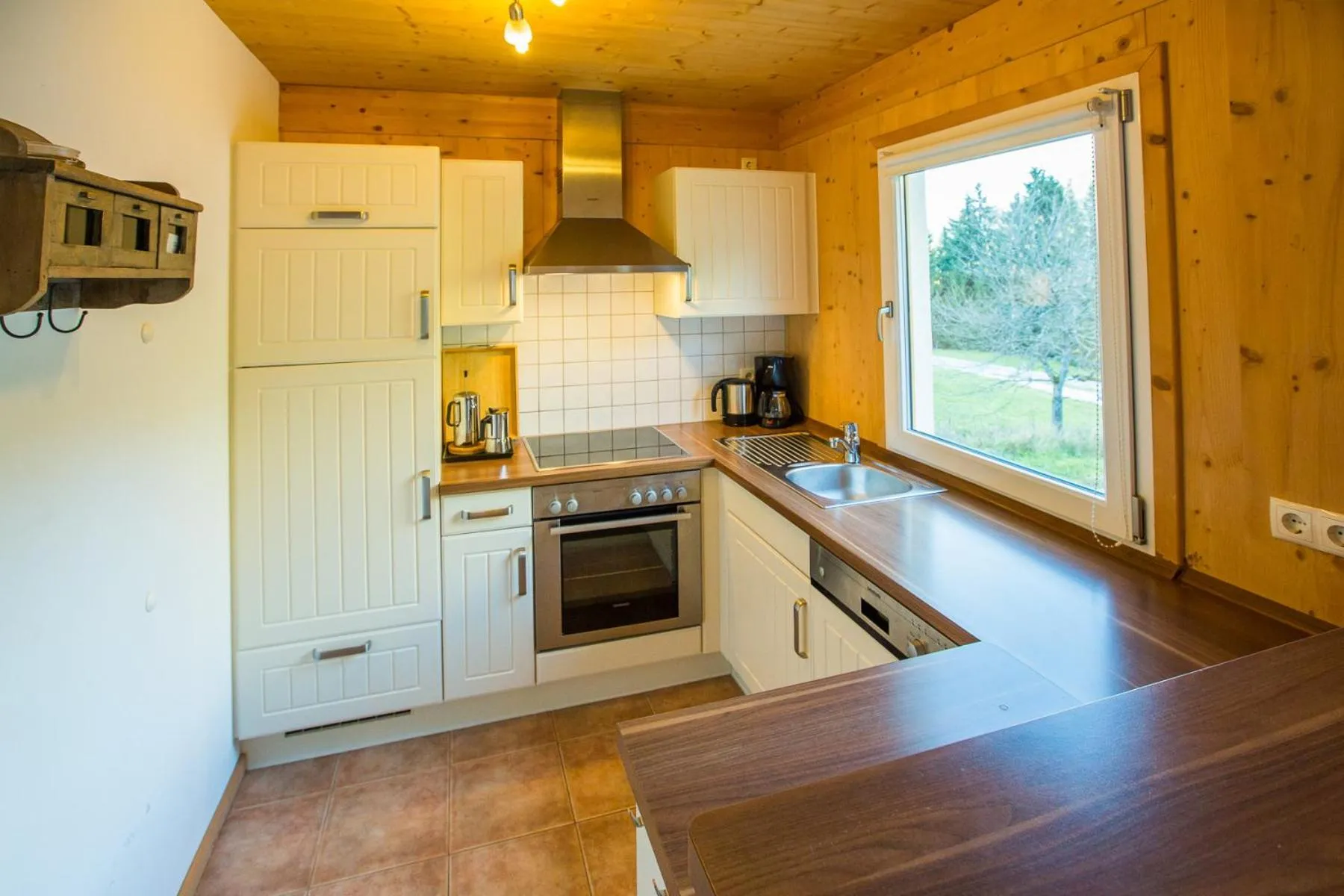 Kitchen or kitchenette in Alpendorf Dachstein West by ALPS RESORTS
