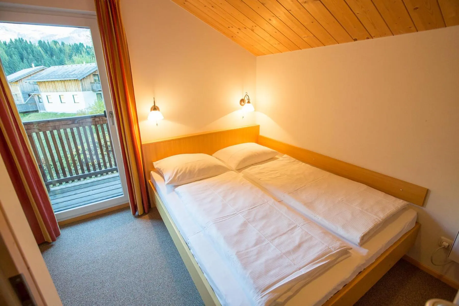 Bedroom, Bed in Alpendorf Dachstein West by ALPS RESORTS
