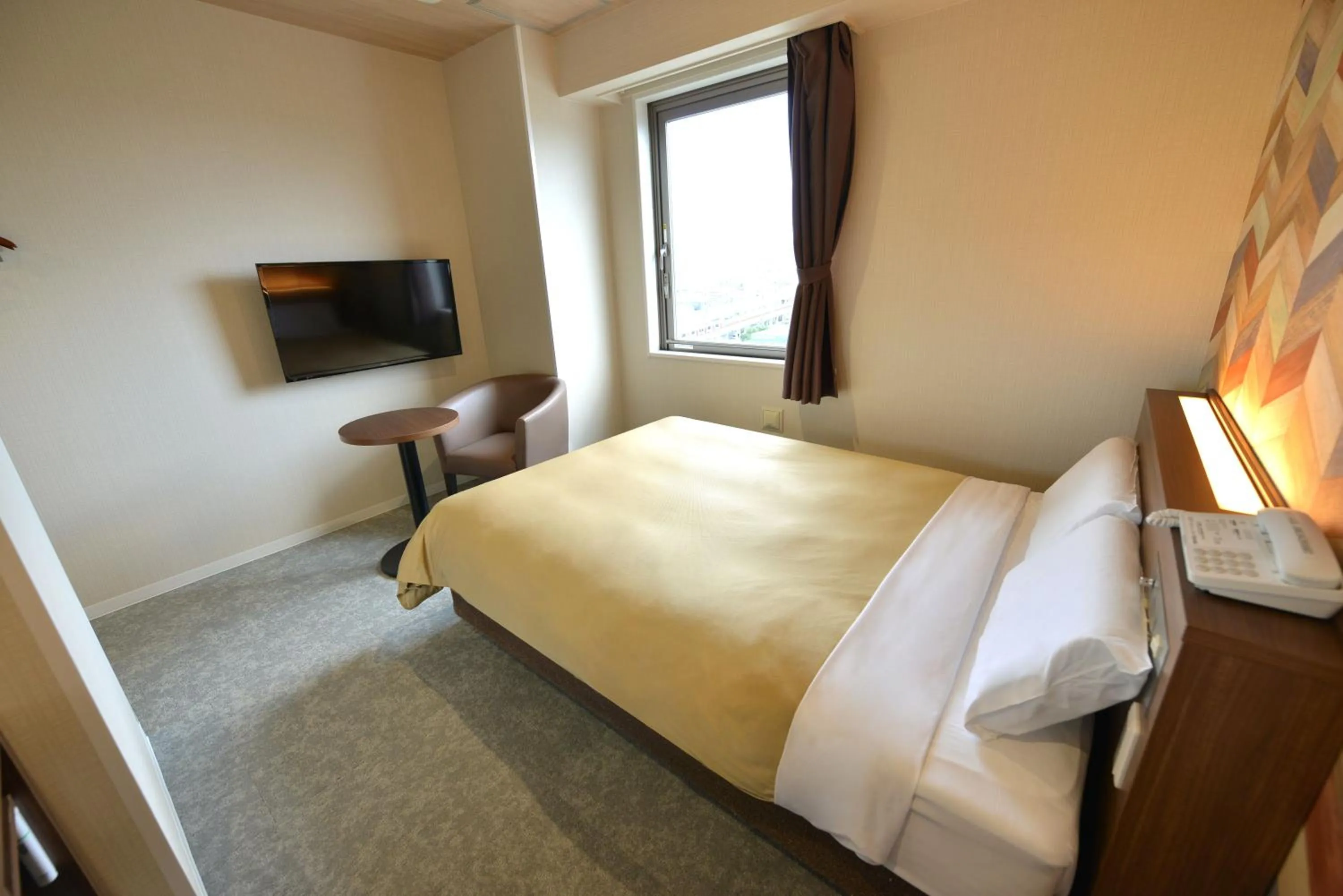 Bed in Hotel New Gaea Nishi Kumamoto Ekimae