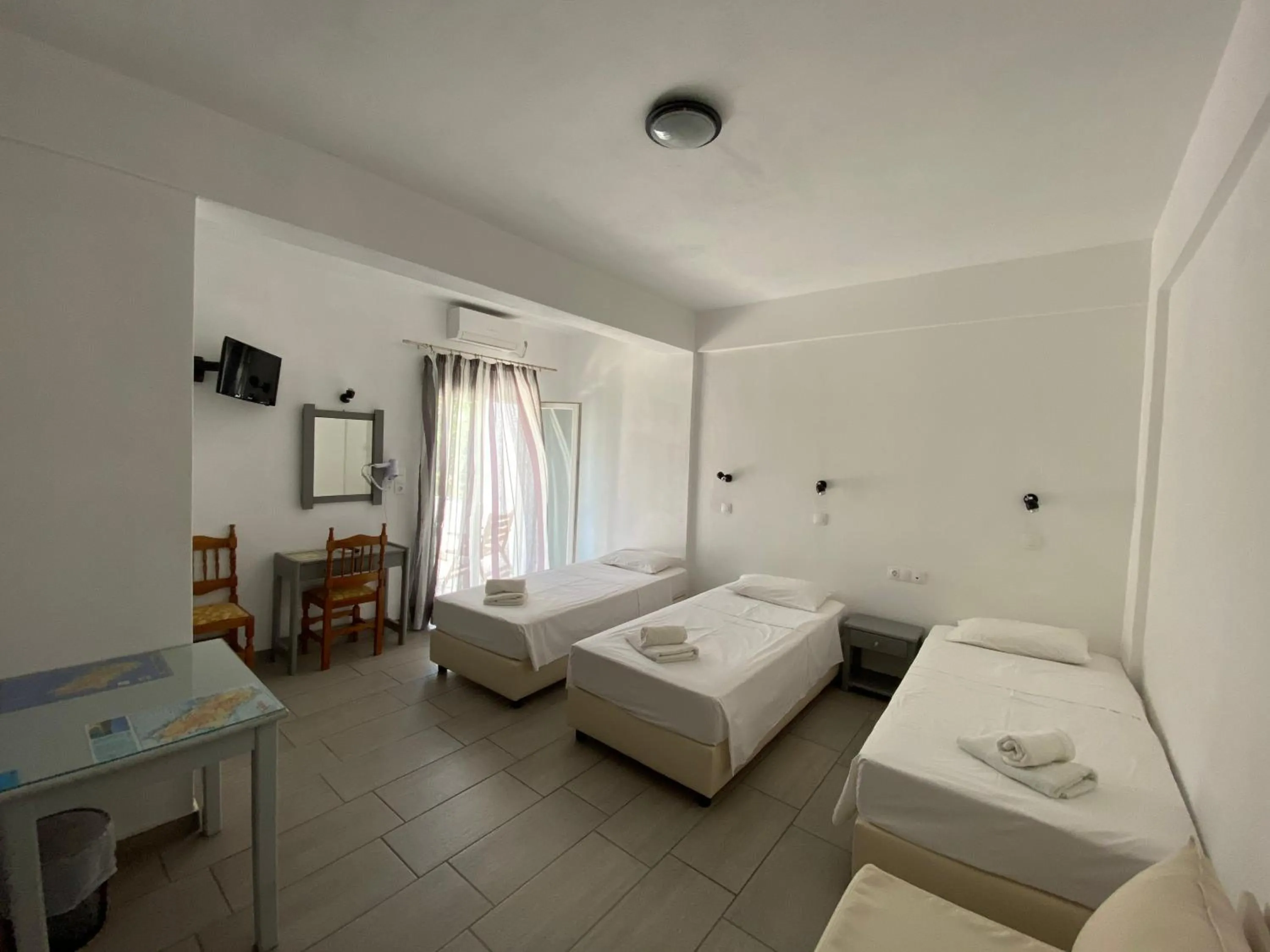 Bed in Deep Blue Rooms & Apartments