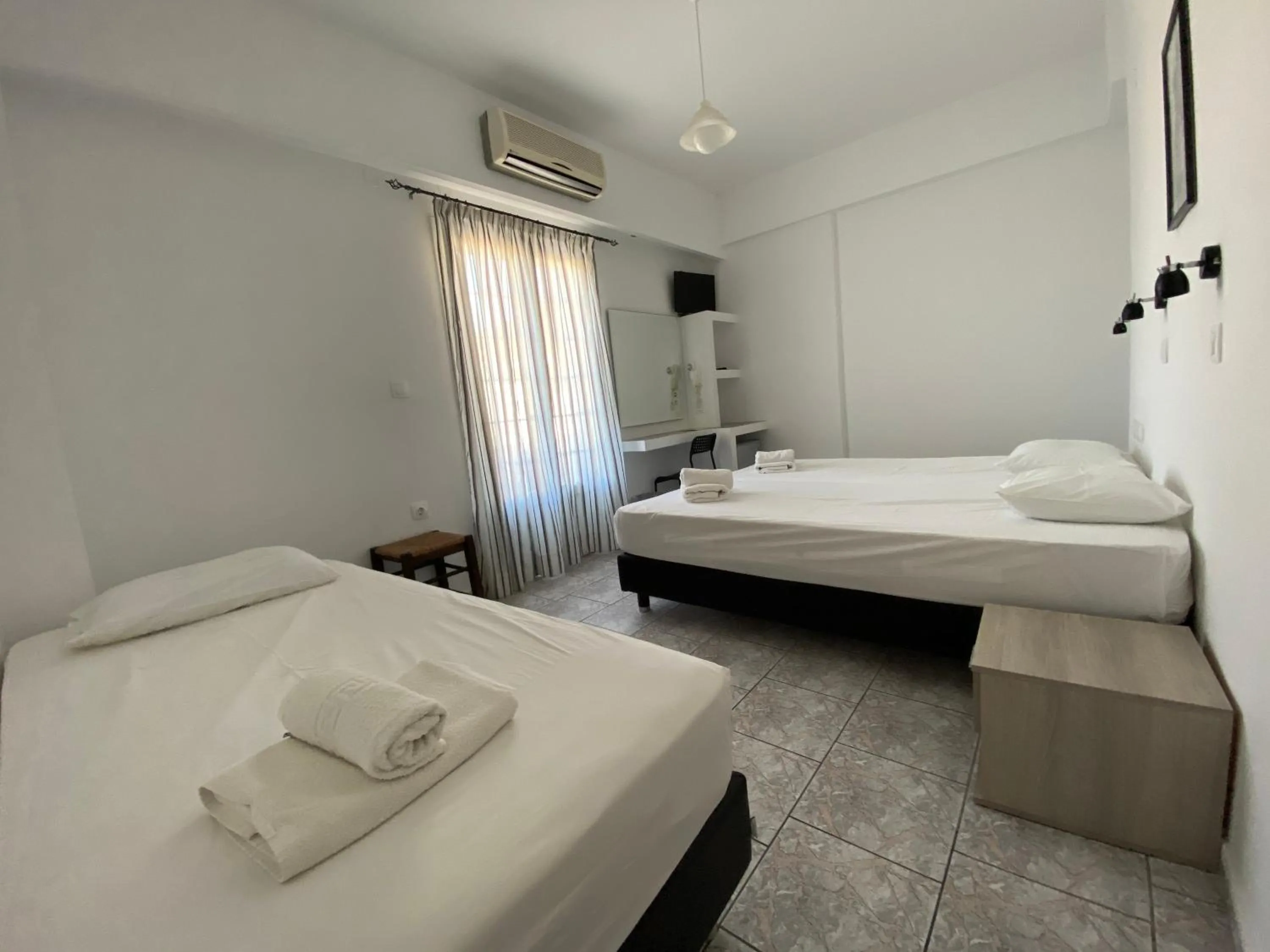 Bed in Deep Blue Rooms & Apartments