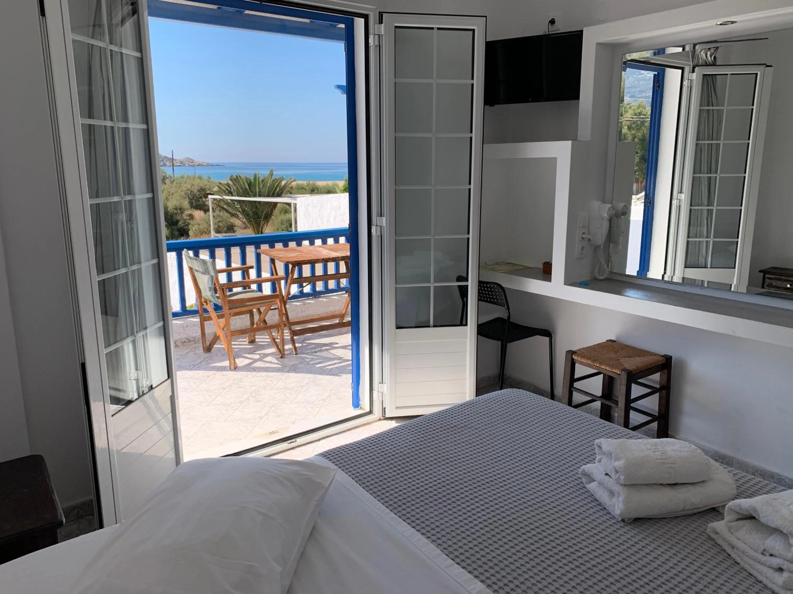 Bed in Deep Blue Rooms & Apartments