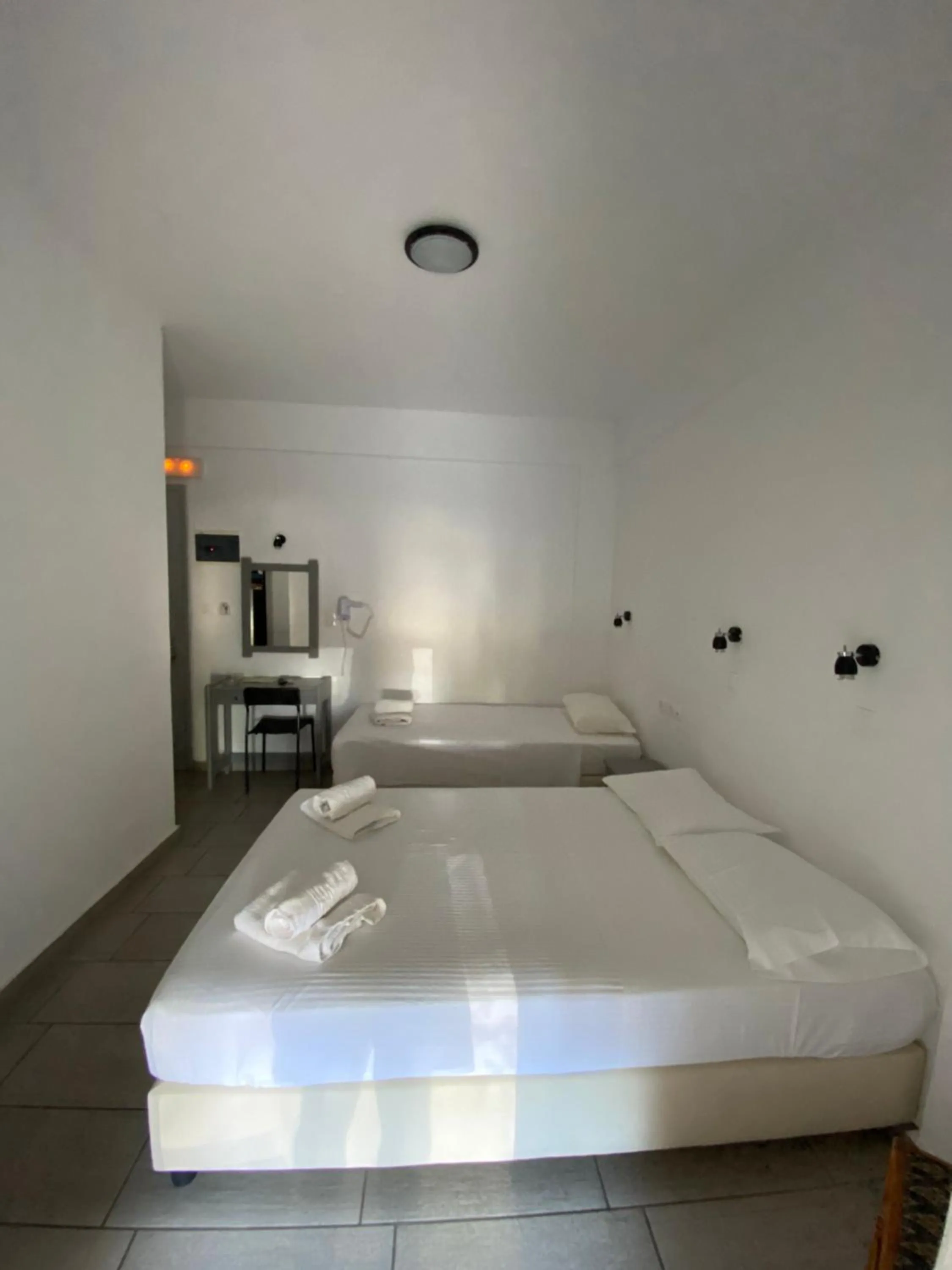 Bed in Deep Blue Rooms & Apartments
