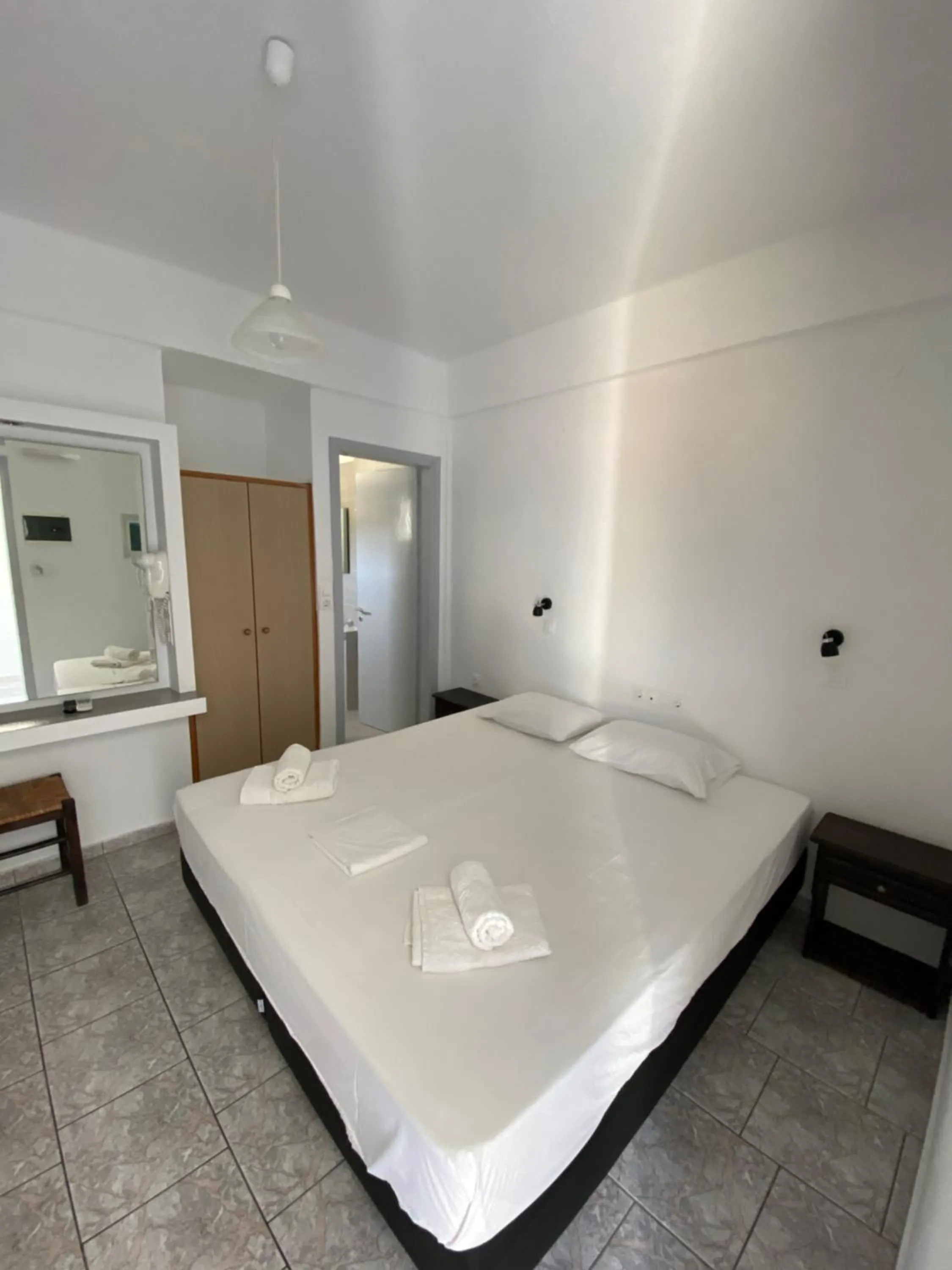 Bed in Deep Blue Rooms & Apartments