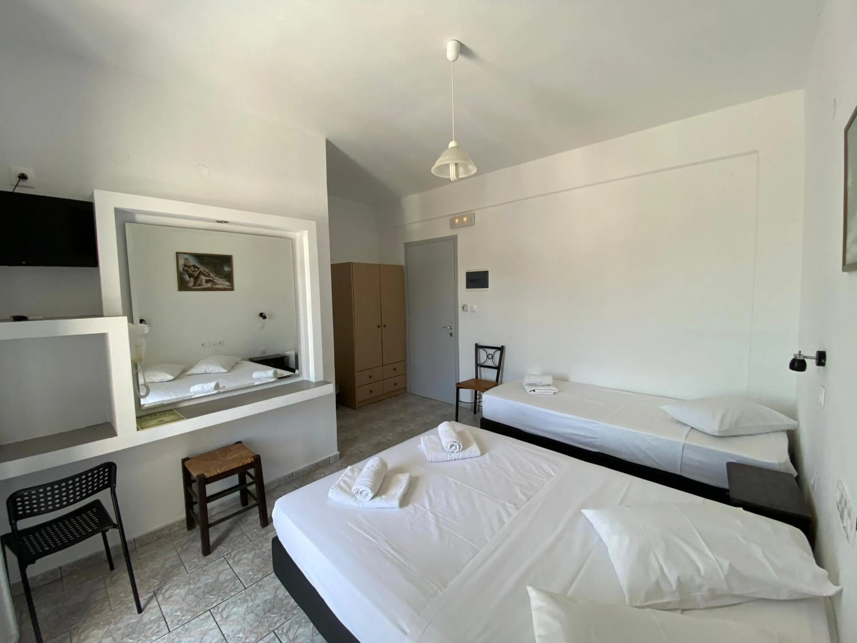 Bed in Deep Blue Rooms & Apartments