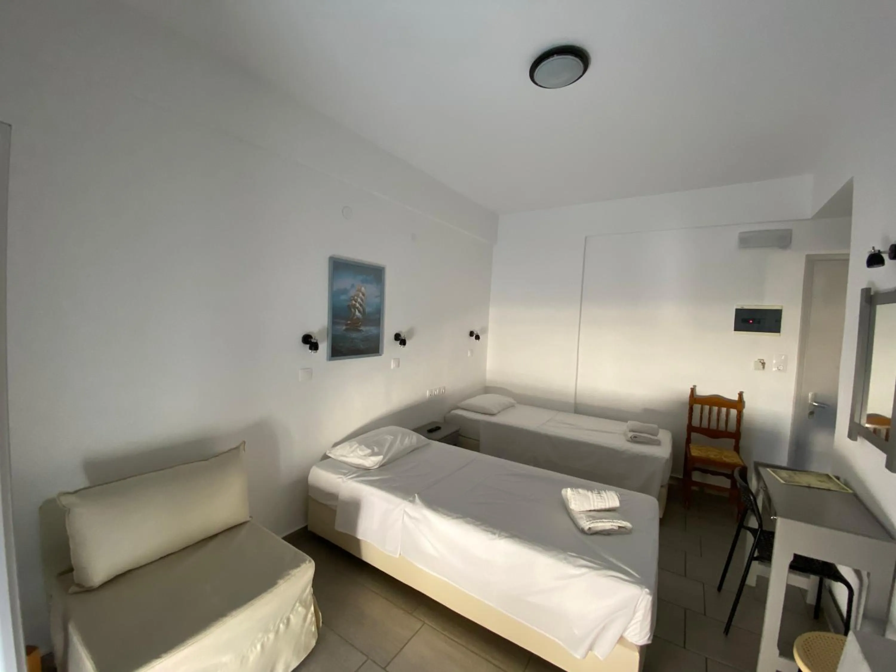 Bed in Deep Blue Rooms & Apartments