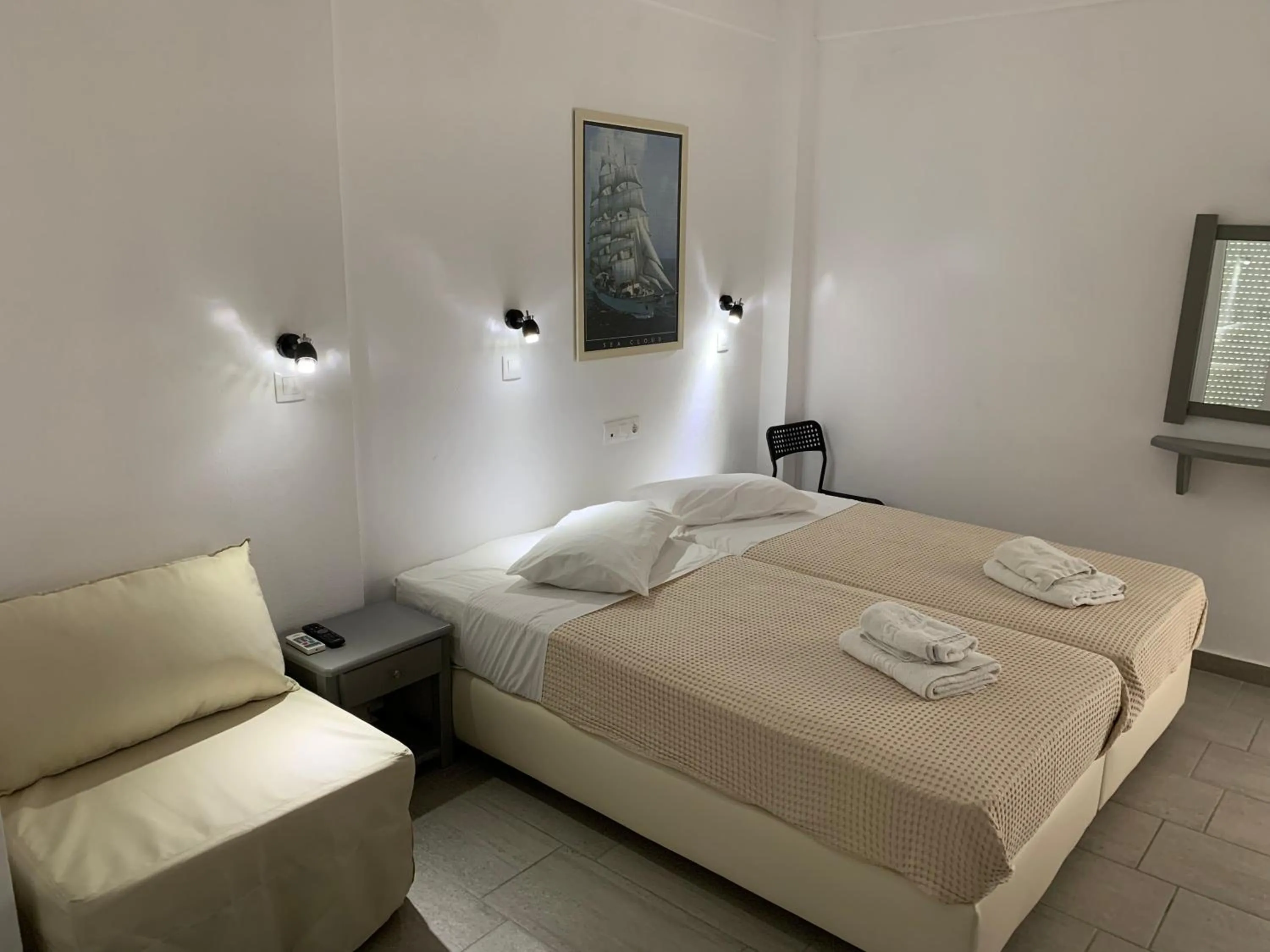 Bed in Deep Blue Rooms & Apartments