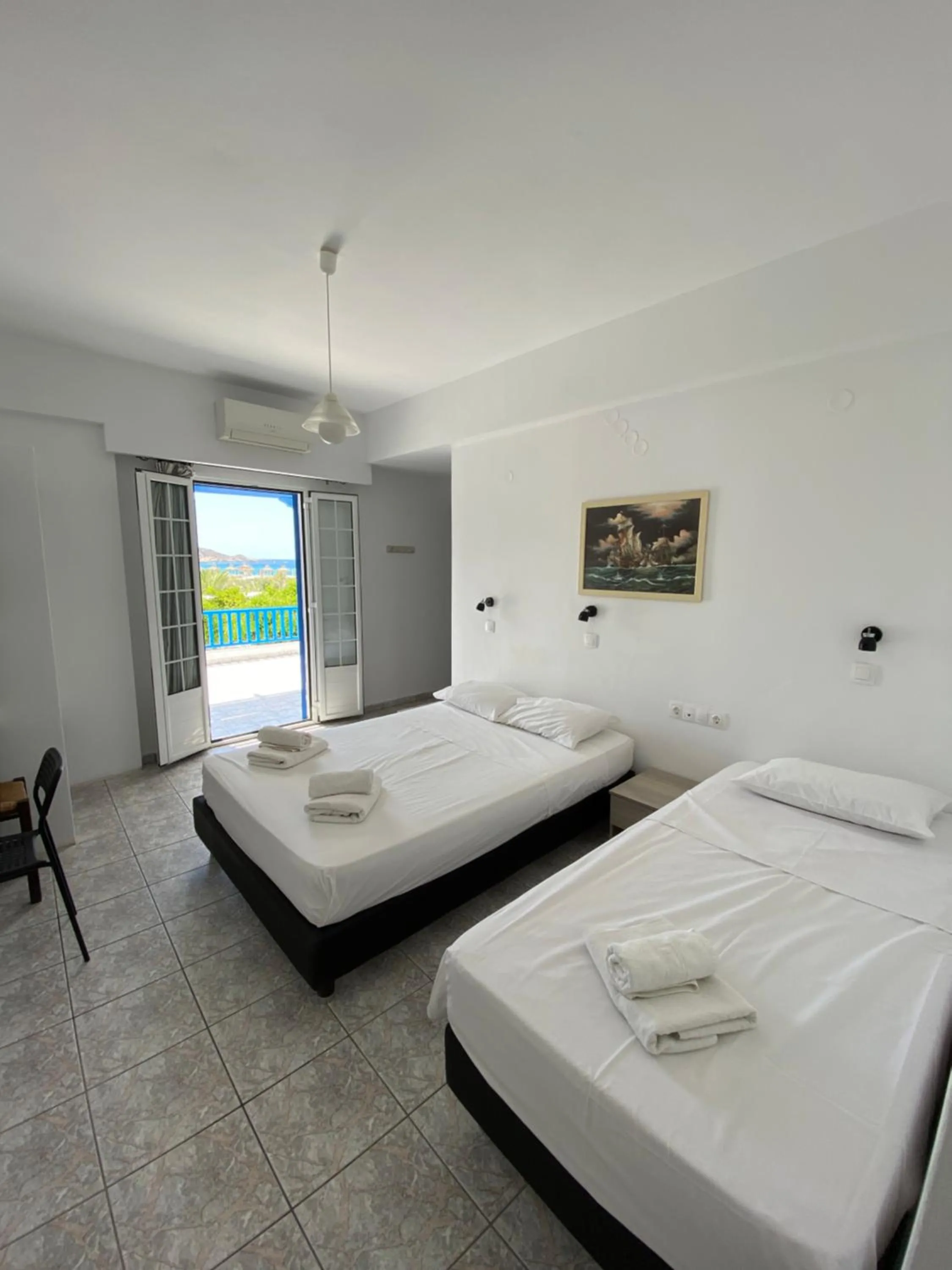 Bed in Deep Blue Rooms & Apartments