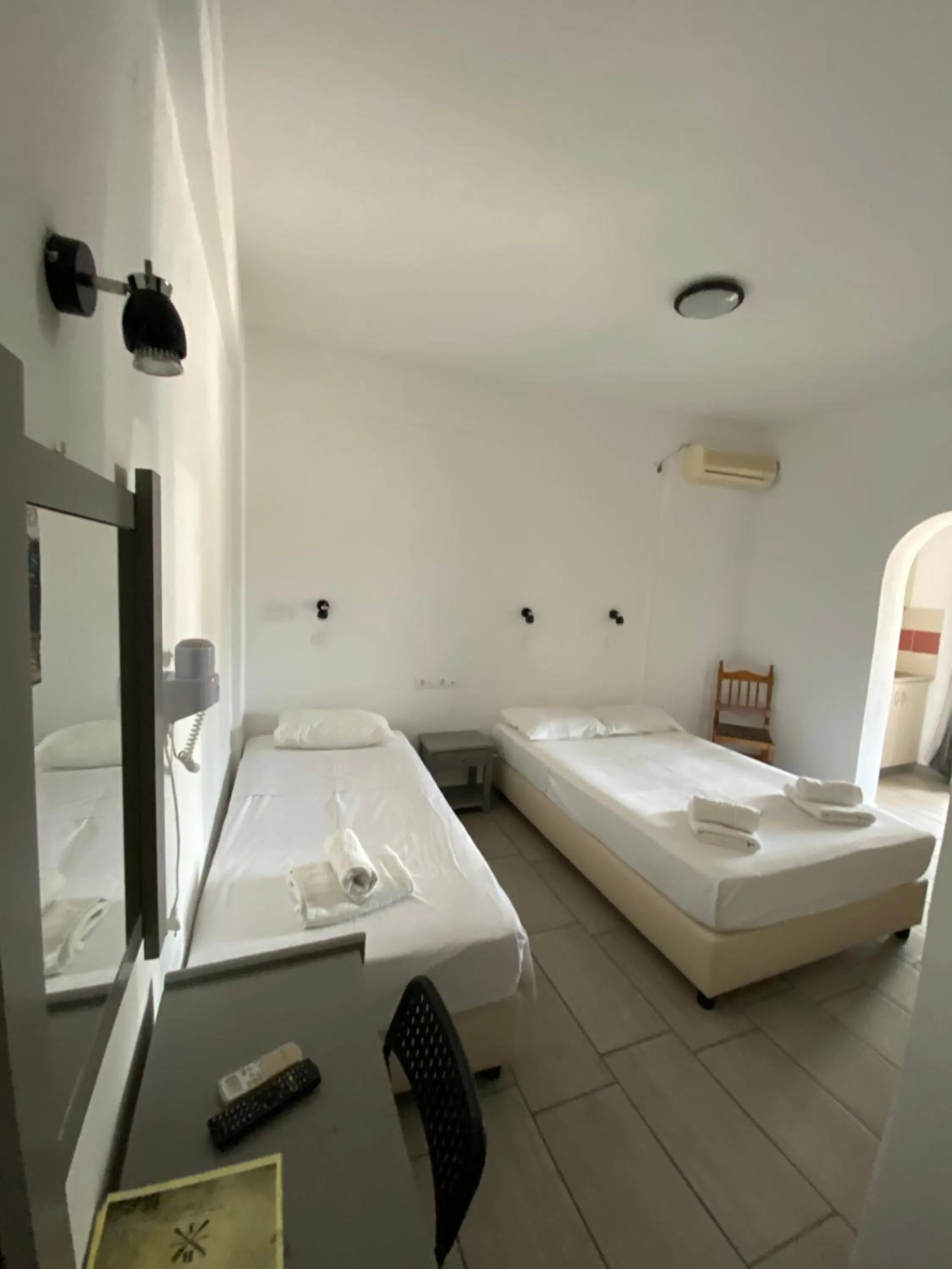 Bed in Deep Blue Rooms & Apartments